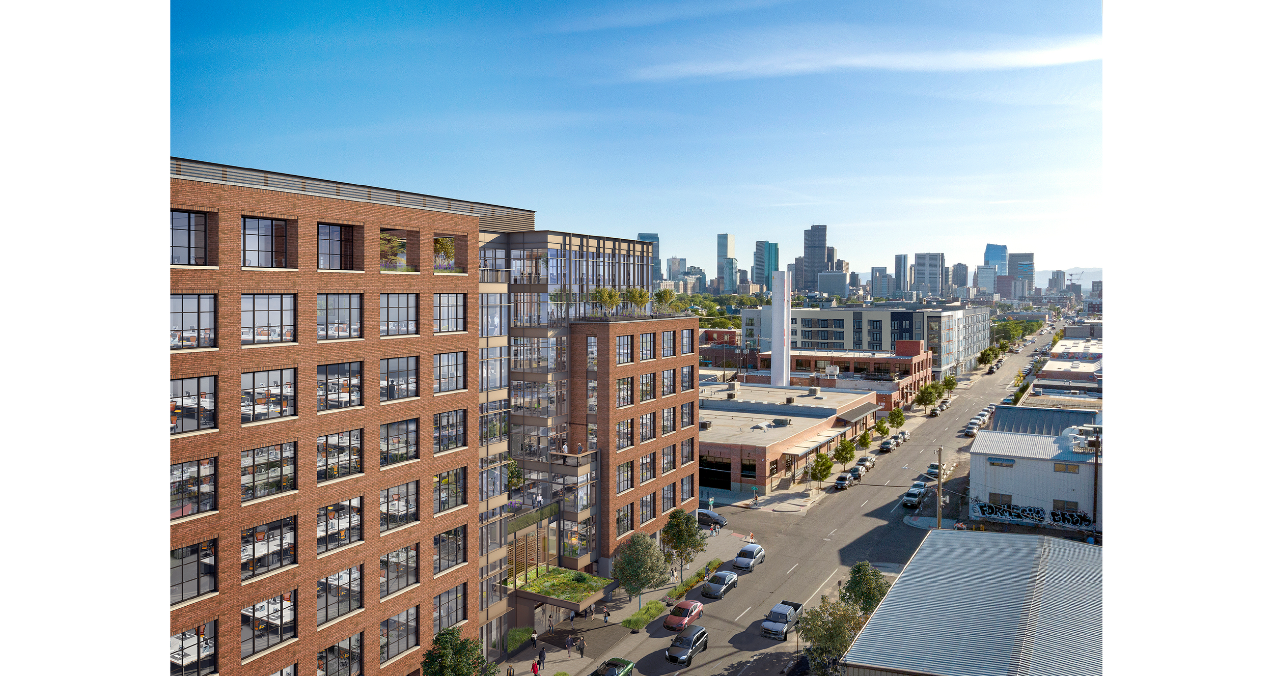 A city street scene with a multi-story red brick building featuring glass windows and a rooftop garden, with cars parked along the street and a skyline of tall skyscrapers in the background.
