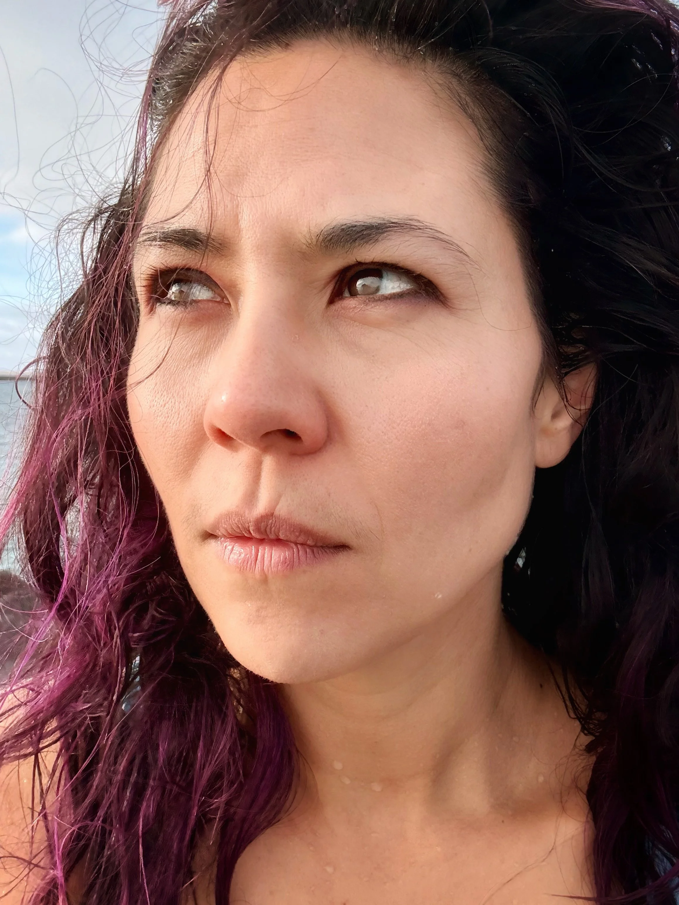 A side profile portrait of Alice Chen looking weathered and pensive, reflecting the depth, honesty and hard-won wisdom behind The Unlearning Studio's work