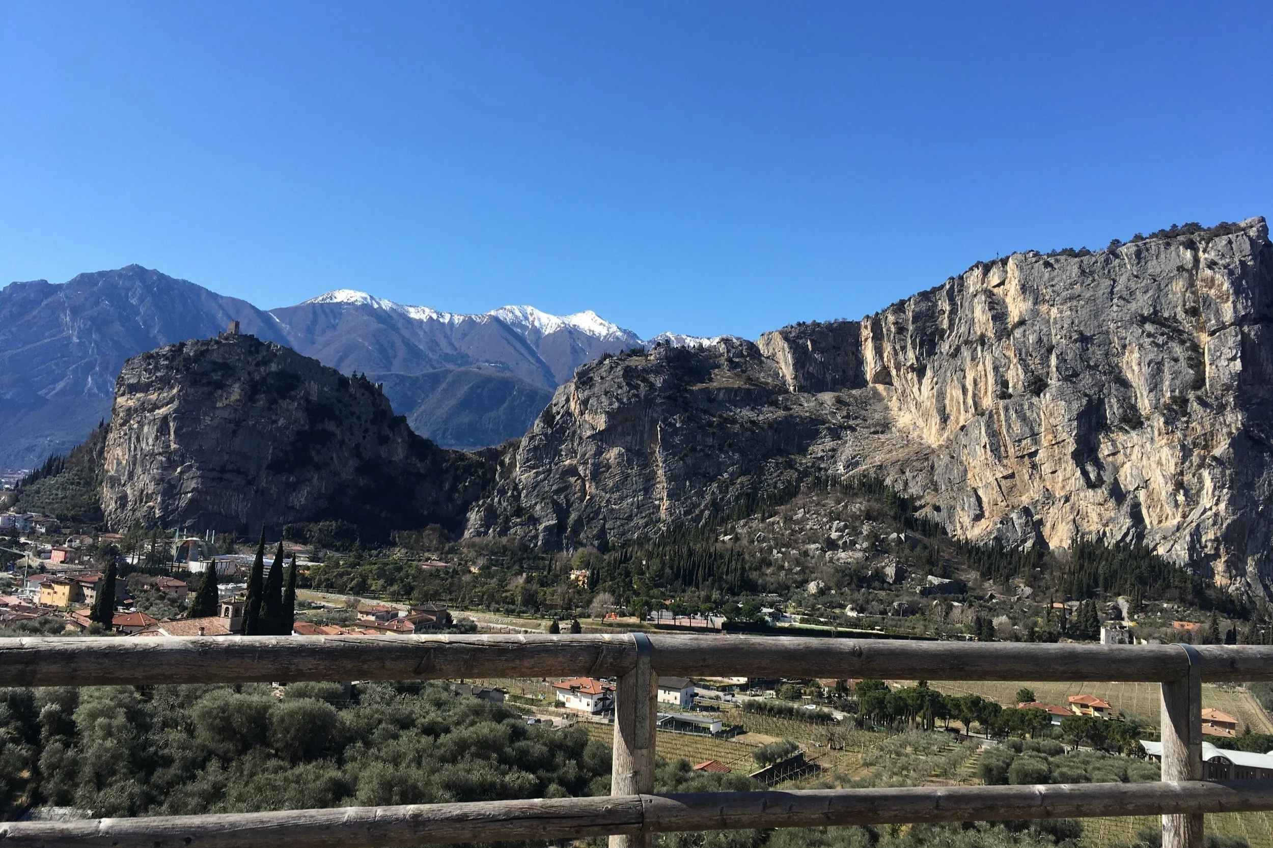 Panoramic view of Arco, Italy, featuring the historic castle, seen from the San Martino rock climbing crag.
