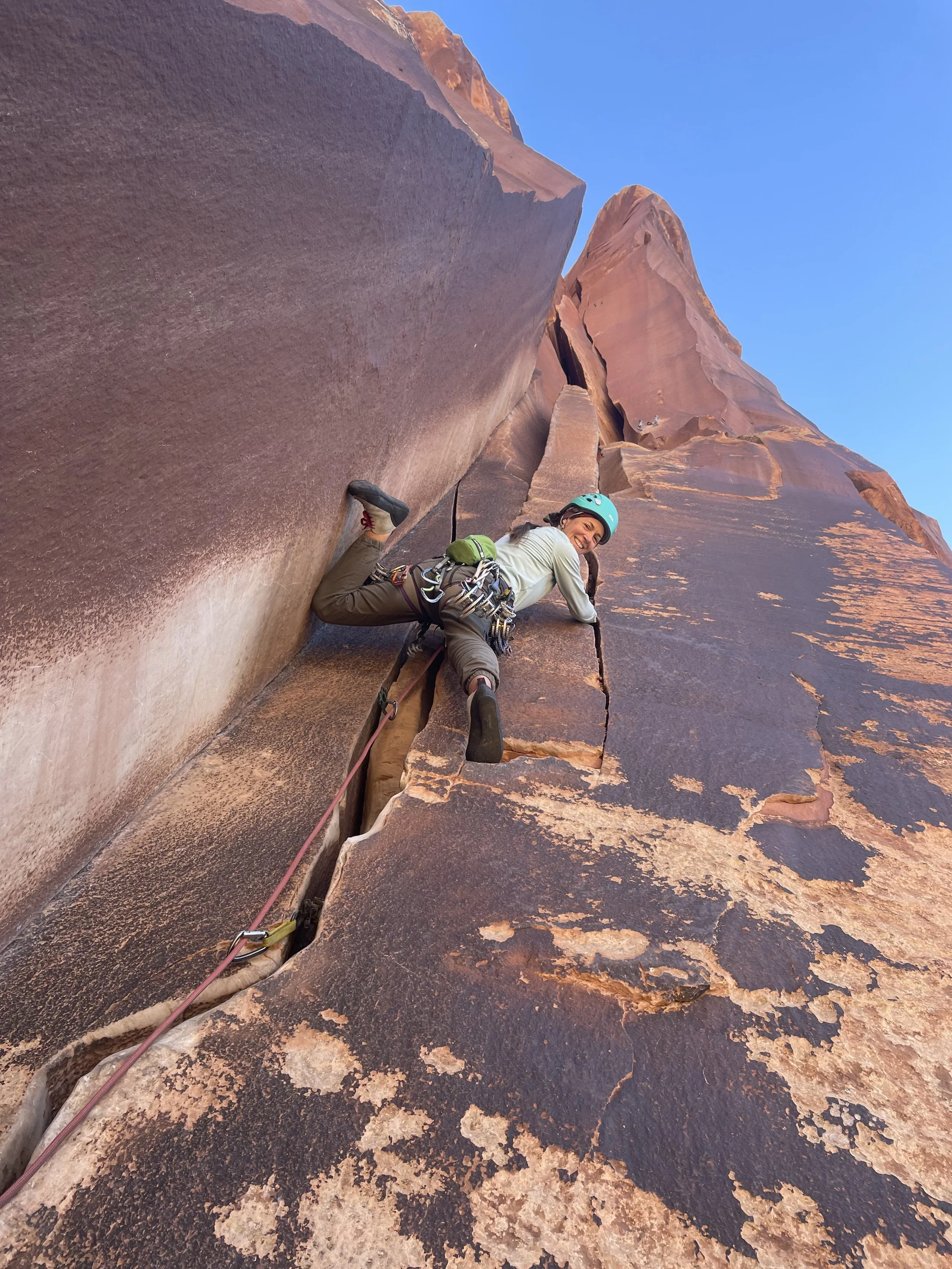 Young woman crack climbing in Indian Creek, Utah, USA