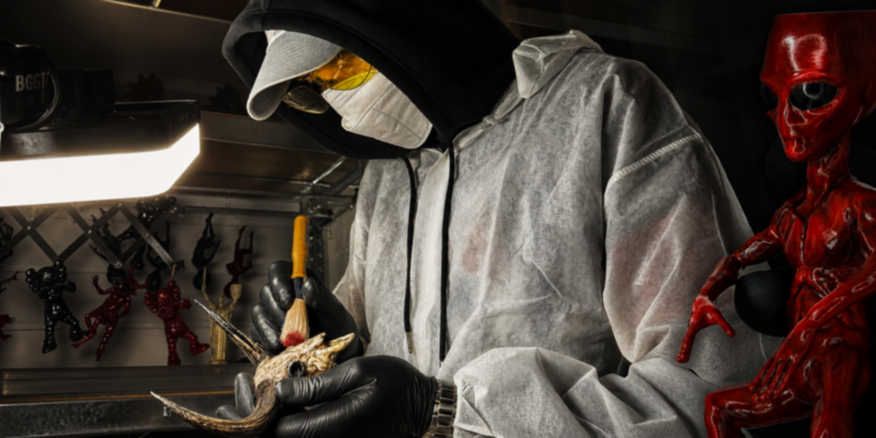 A master paints figurines in a workshop