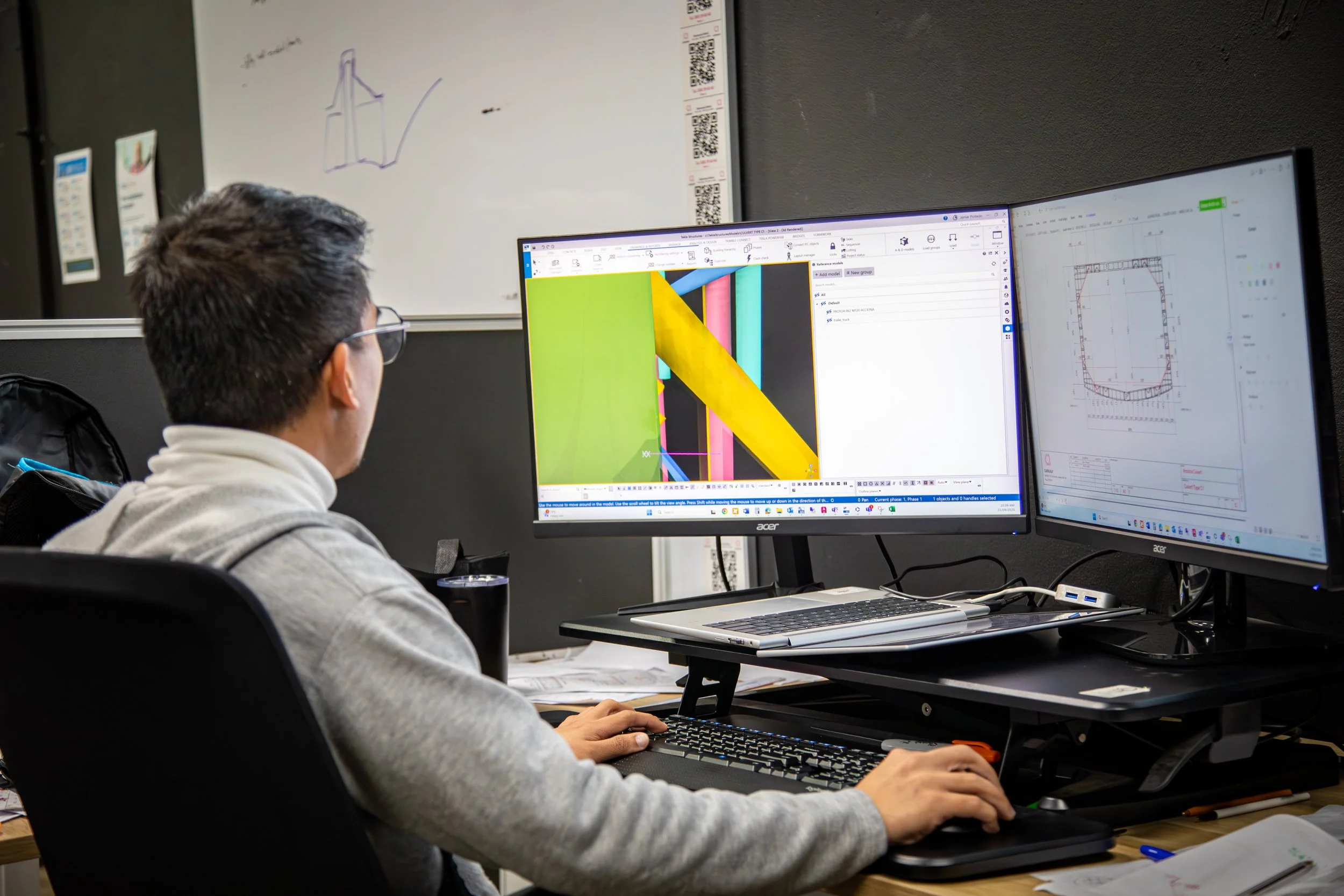 Carrabay engineer using 3D modelling software and technical drawings for structural design.