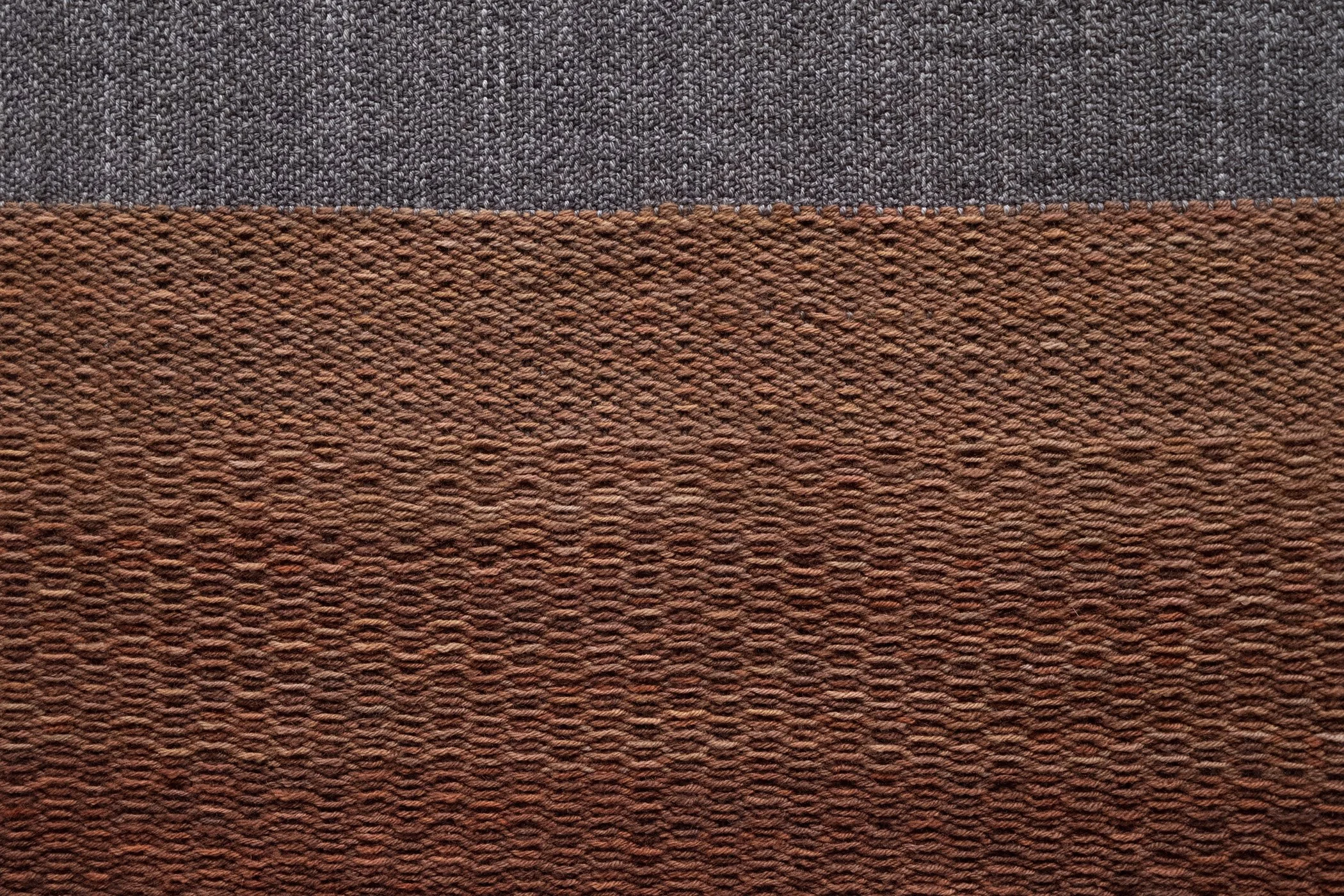 Pine. 2026. (Detail).
Woven Aotearoa-grown Corriedale wool, hand-formed papa clay, aluminium tube, jute twine.
62 x 185 cm.

Photo: Shaun Matthews.