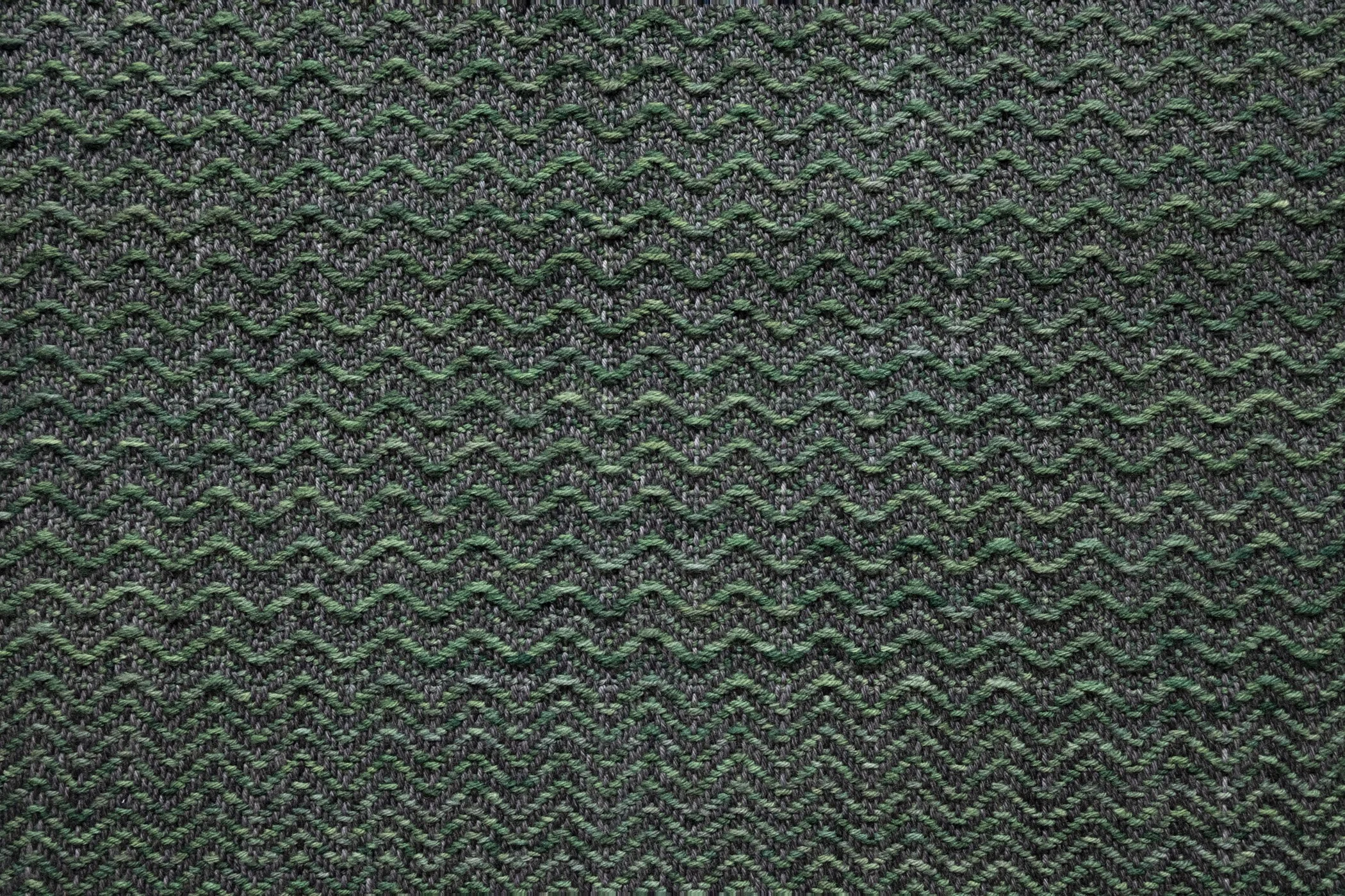 Pine. 2026. (Detail).
Woven Aotearoa-grown Corriedale wool, hand-formed papa clay, aluminium tube, jute twine.
62 x 185 cm.

Photo: Shaun Matthews.