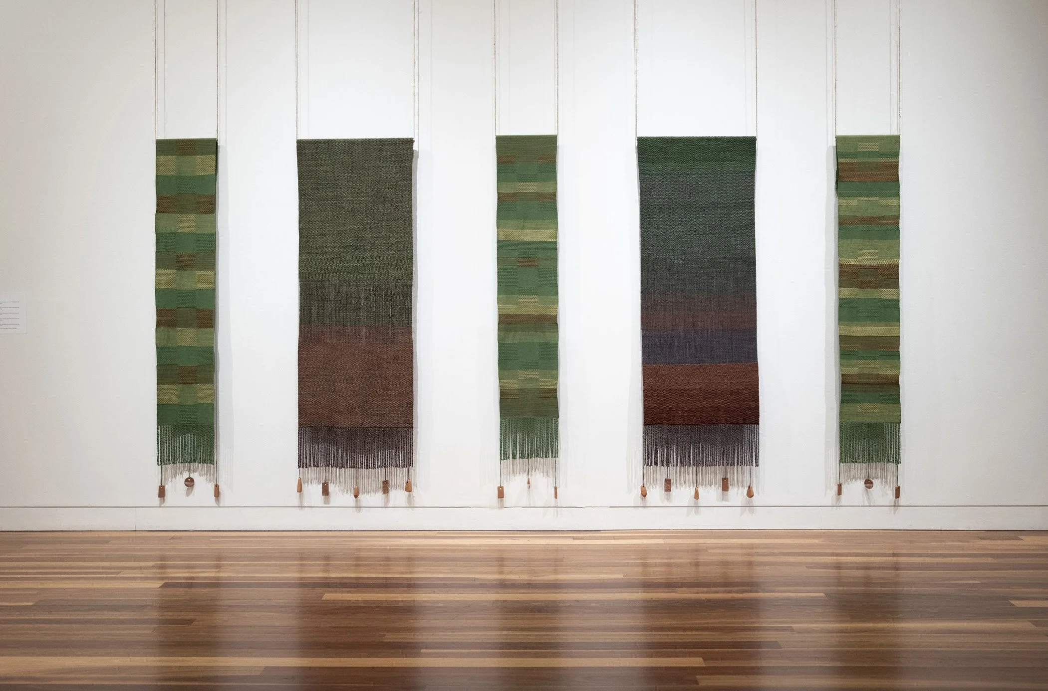 Pasture I. 2026.
Woven Aotearoa-grown Corriedale wool, hand-formed papa clay, aluminium tube, jute twine.
32 x 185 cm

Bush. 2026.
Woven Aotearoa-grown Corriedale wool, hand-formed papa clay, aluminium tube, jute twine.
62 x 185 cm

Pasture II. 2026.