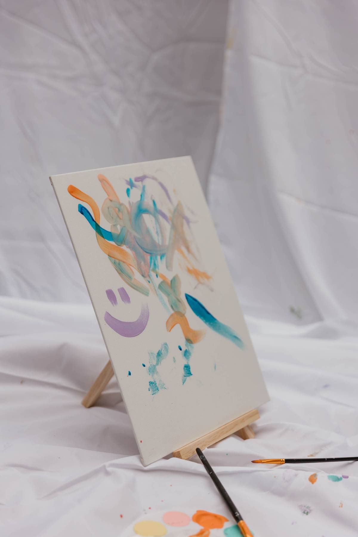 Colorful painting of a smile and abstract lines for a creative design studio