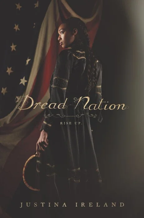 Cover for Dread Nation by Justina Ireland. A black woman in a dark dress holding a bloody scythe with the American flag in the background.