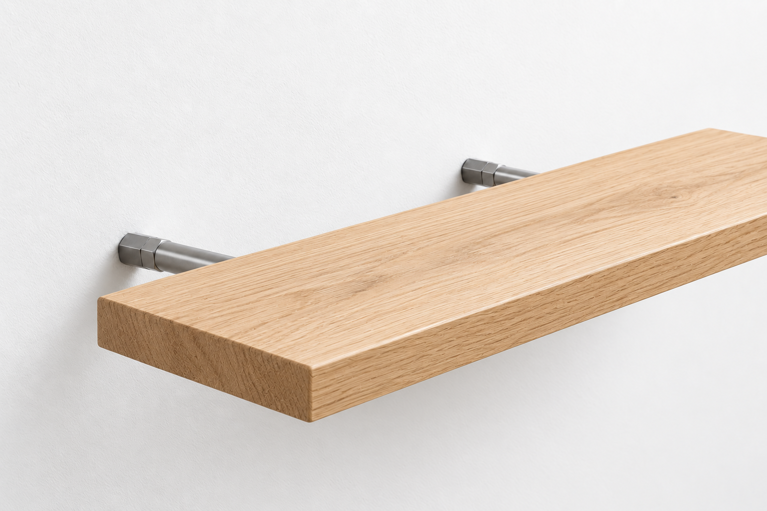 American Oak floating shelf partially slid onto concealed steel mounting pins in a white wall.