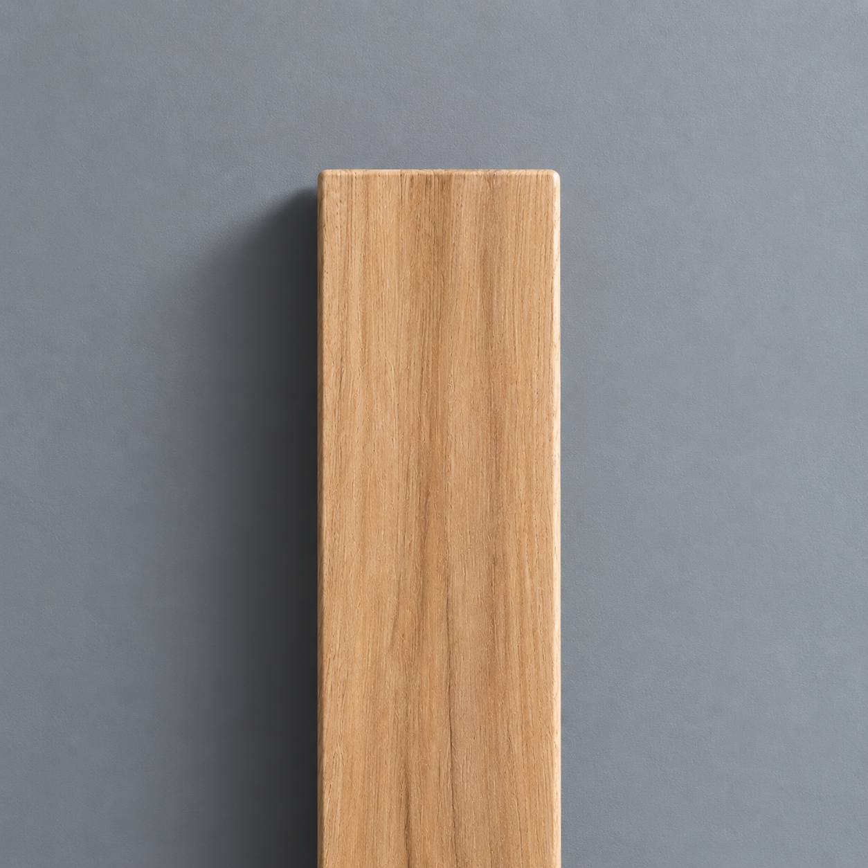 Tasmanian Oak timber sample showing warm golden tones and natural straight grain.