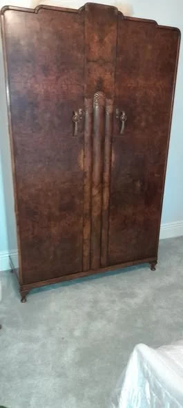 1930s walnut wardrobe showing heat damaged doors having been repaired