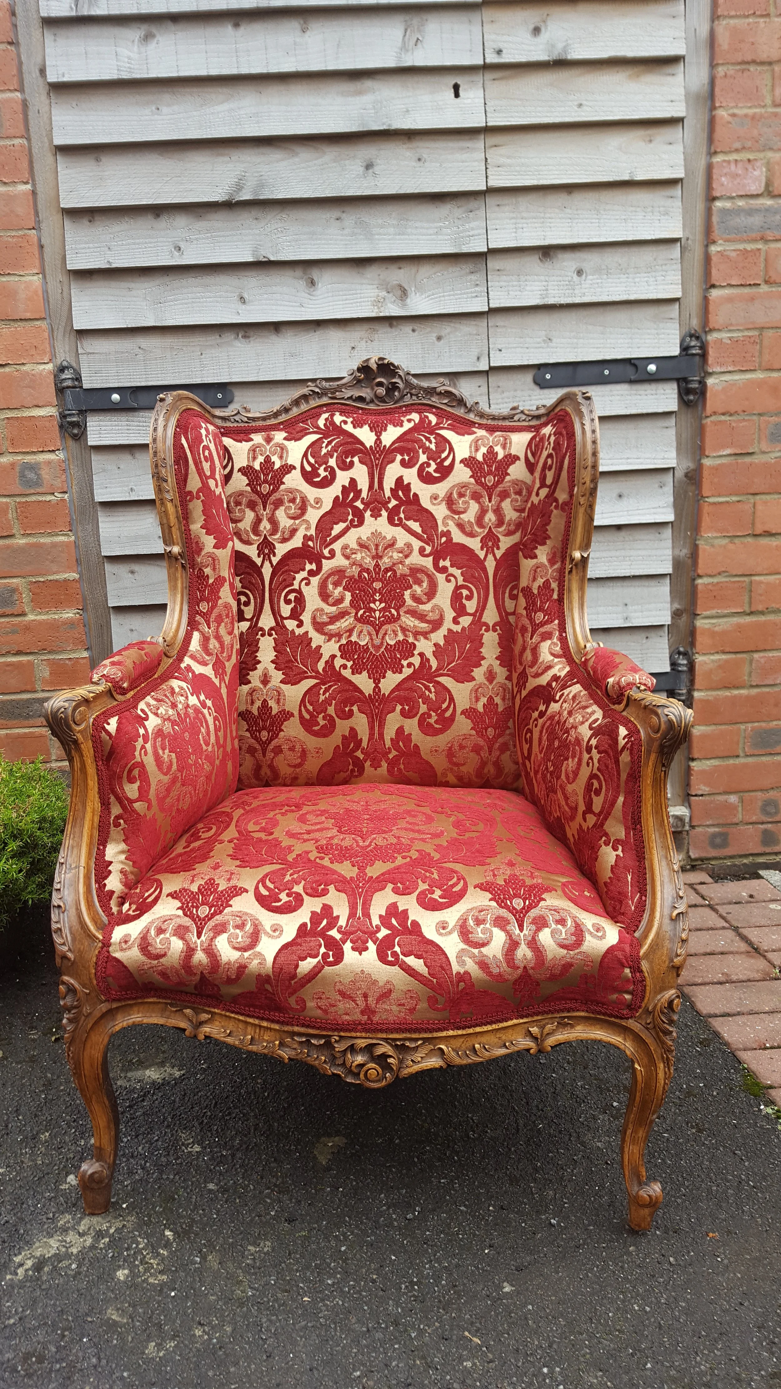 Oak framed Victorian easy Armchair which has been rupholstered in a red and cream material