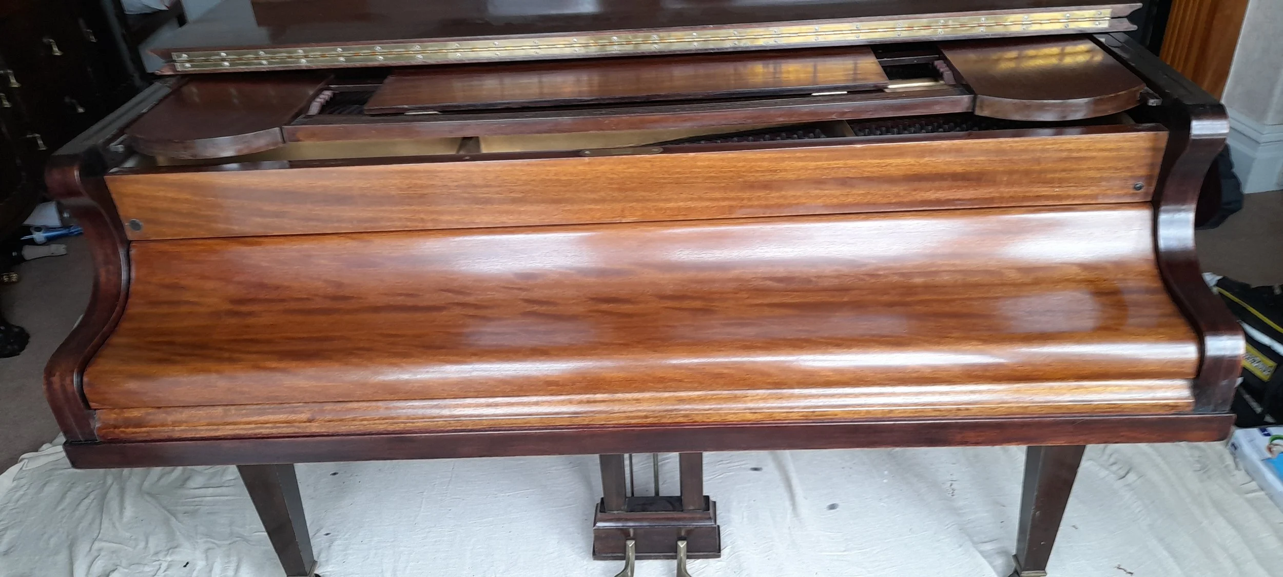 Picture of Grand piano showing front after repolishing