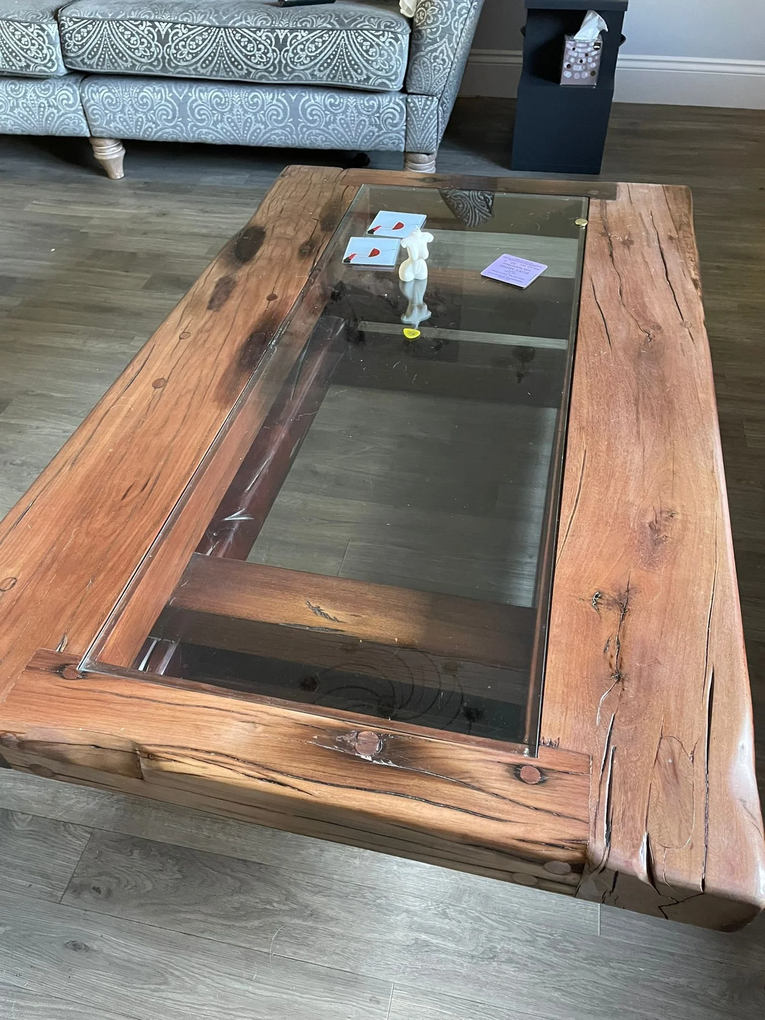Teak South African coffe table with glass centre showing discolouration due to fading from sunlight