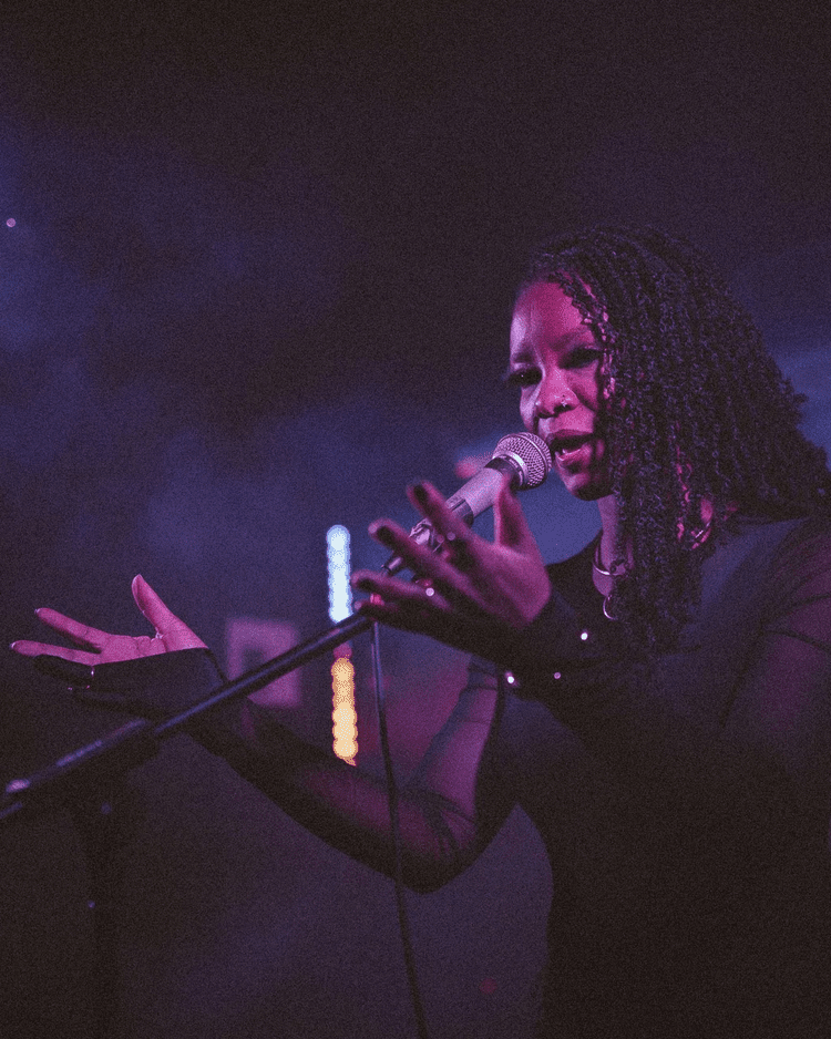 Uju on stage during a live performance
