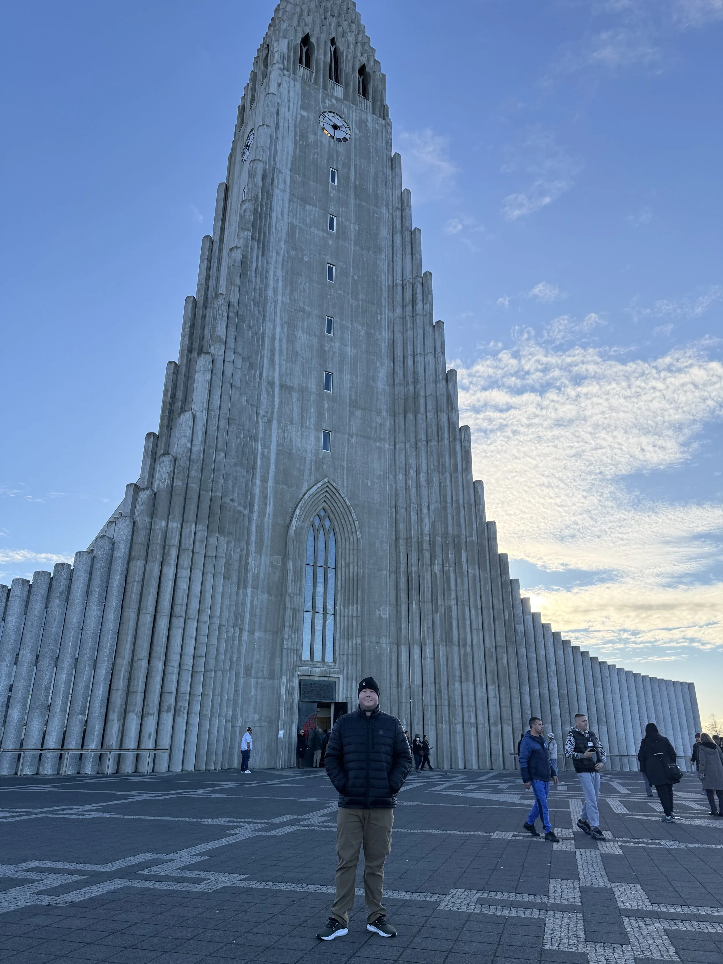 The founder of Glucose Getaways standing in front of the iconic church in Reykjavik Iceland.