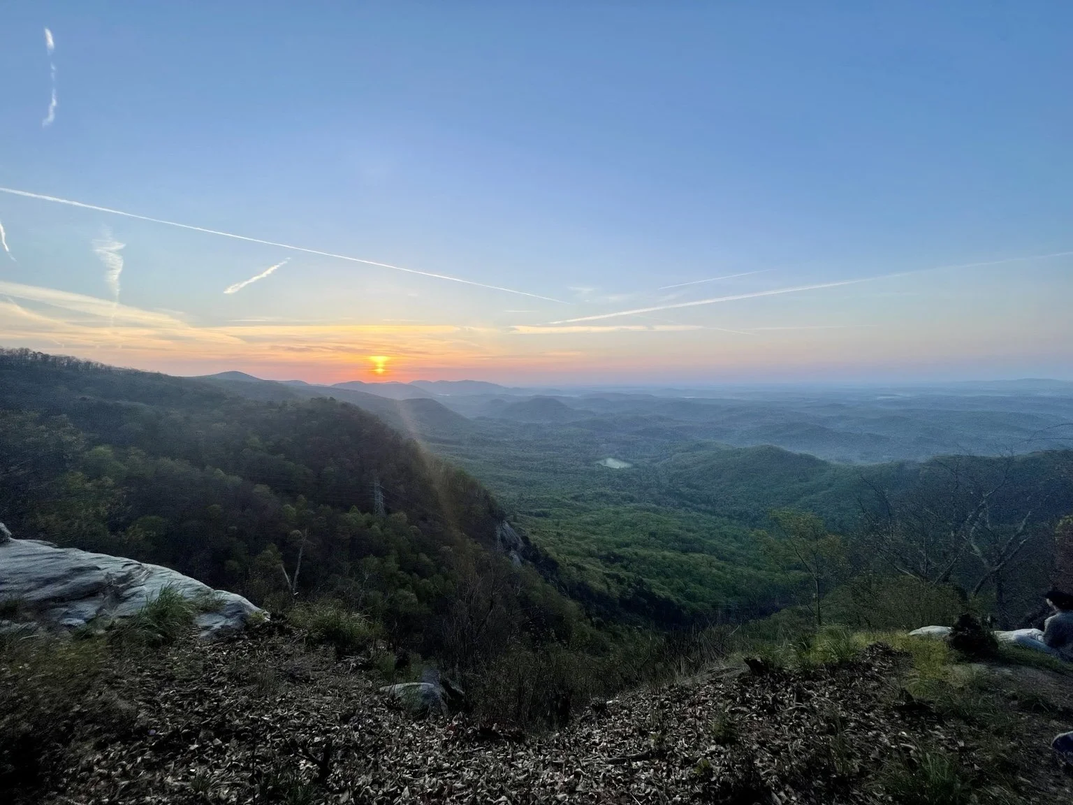 Sunset over a wide mountain landscape during a scenic getaway.