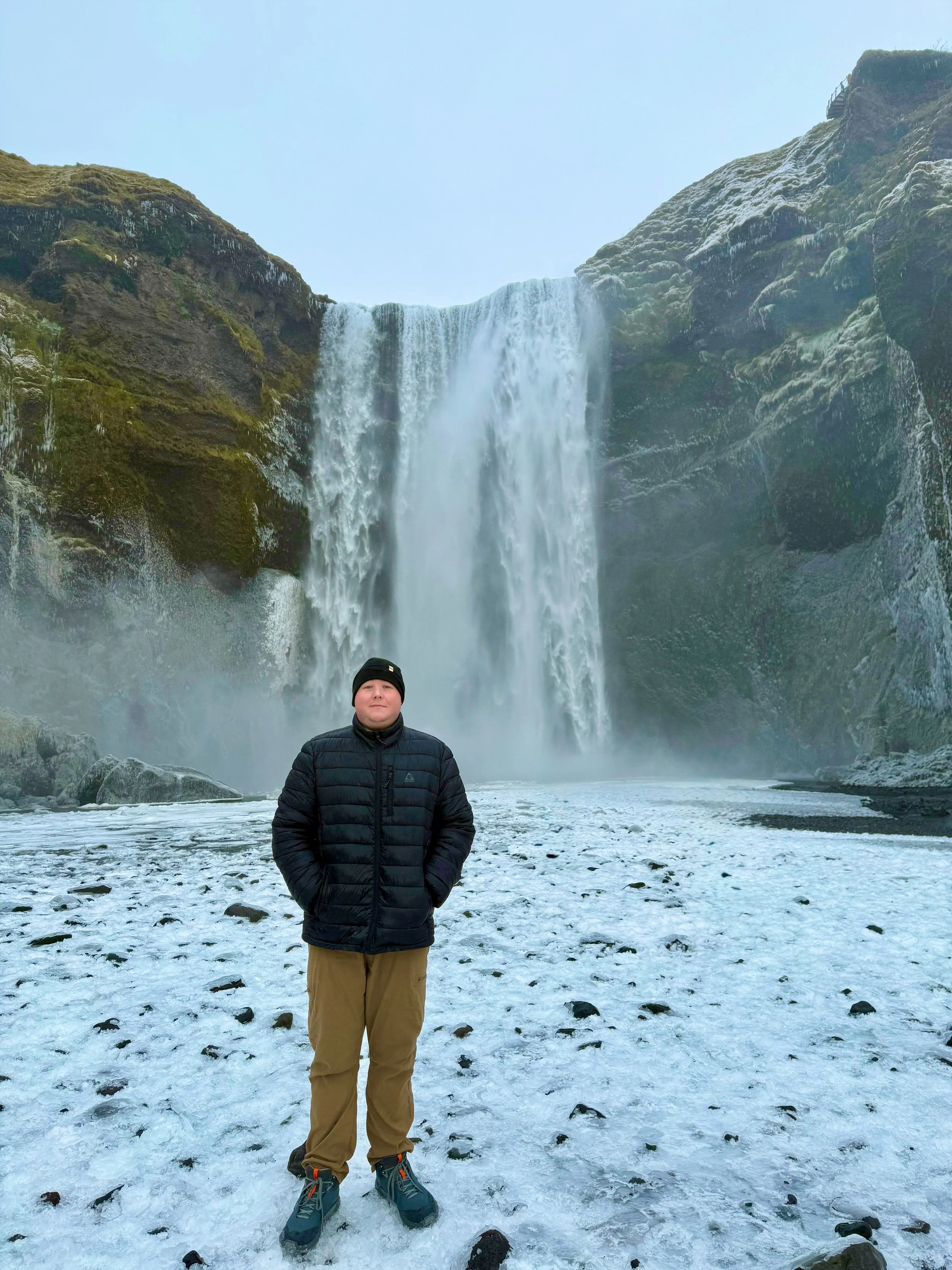 Founder of Glucose Getaways standing in front of one of Iceland's largest waterfalls.