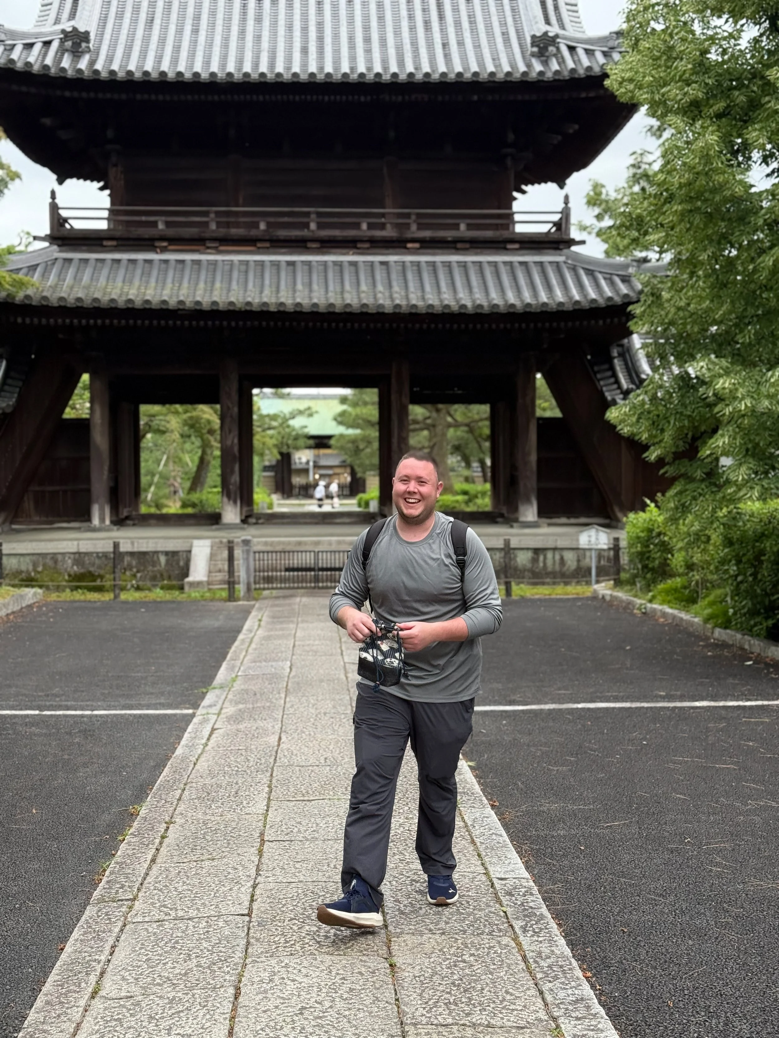 Traveler exploring an ancient Japanese temple during a trip through Japan.