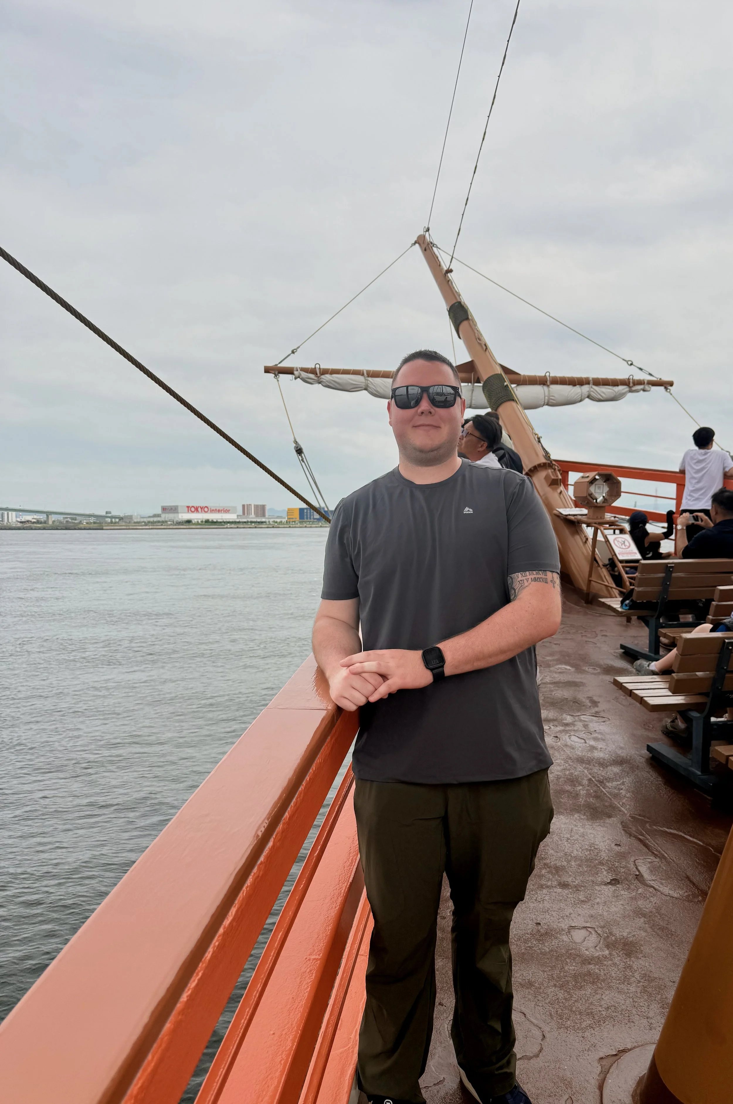 Traveler standing on the Santa Maria sightseeing ship near Osaka Aquarium Kaiyukan in Osaka, Japan.