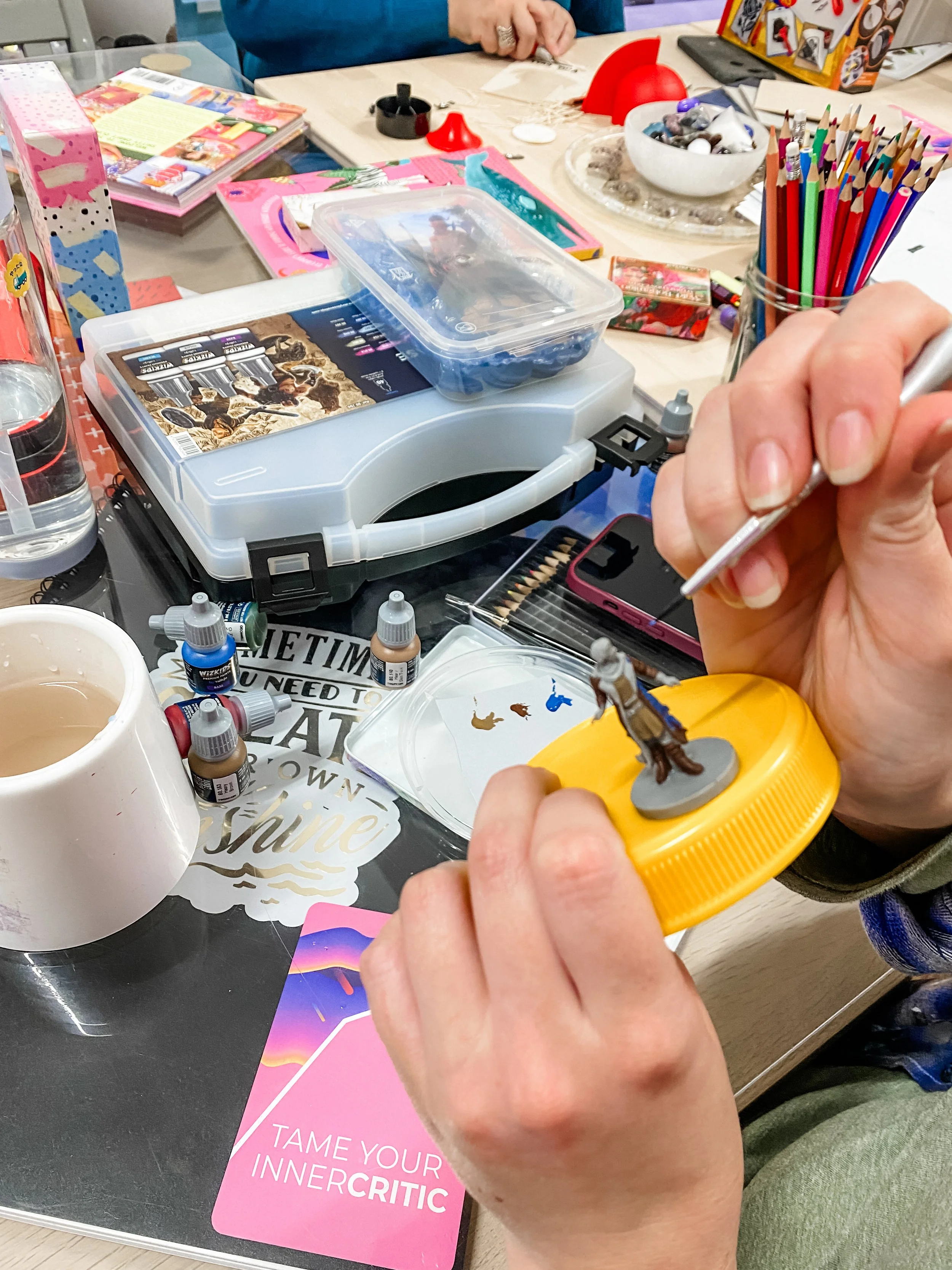 Tess doing mini painting in creative huddle.JPG