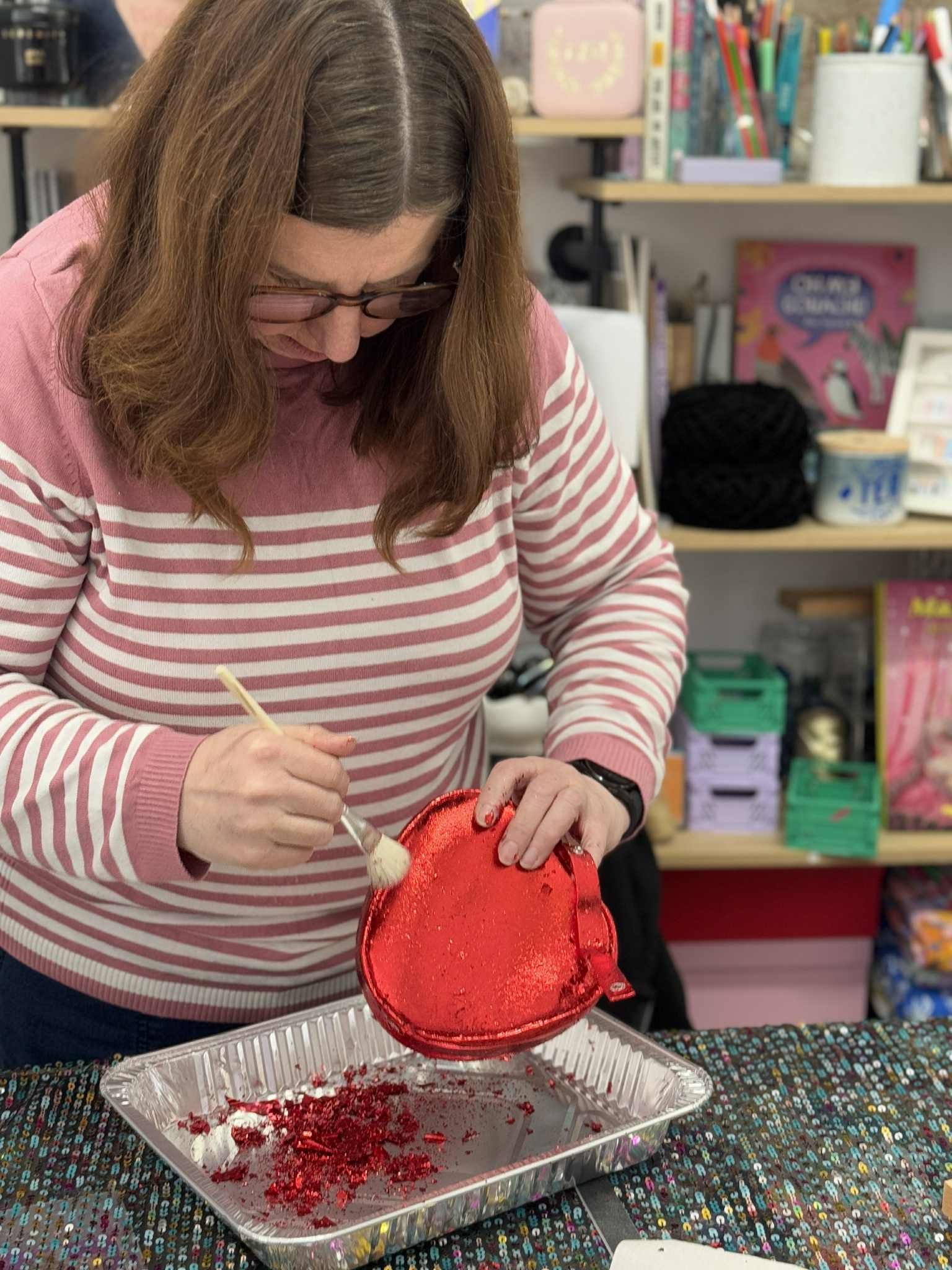 Woman foiling her clutch