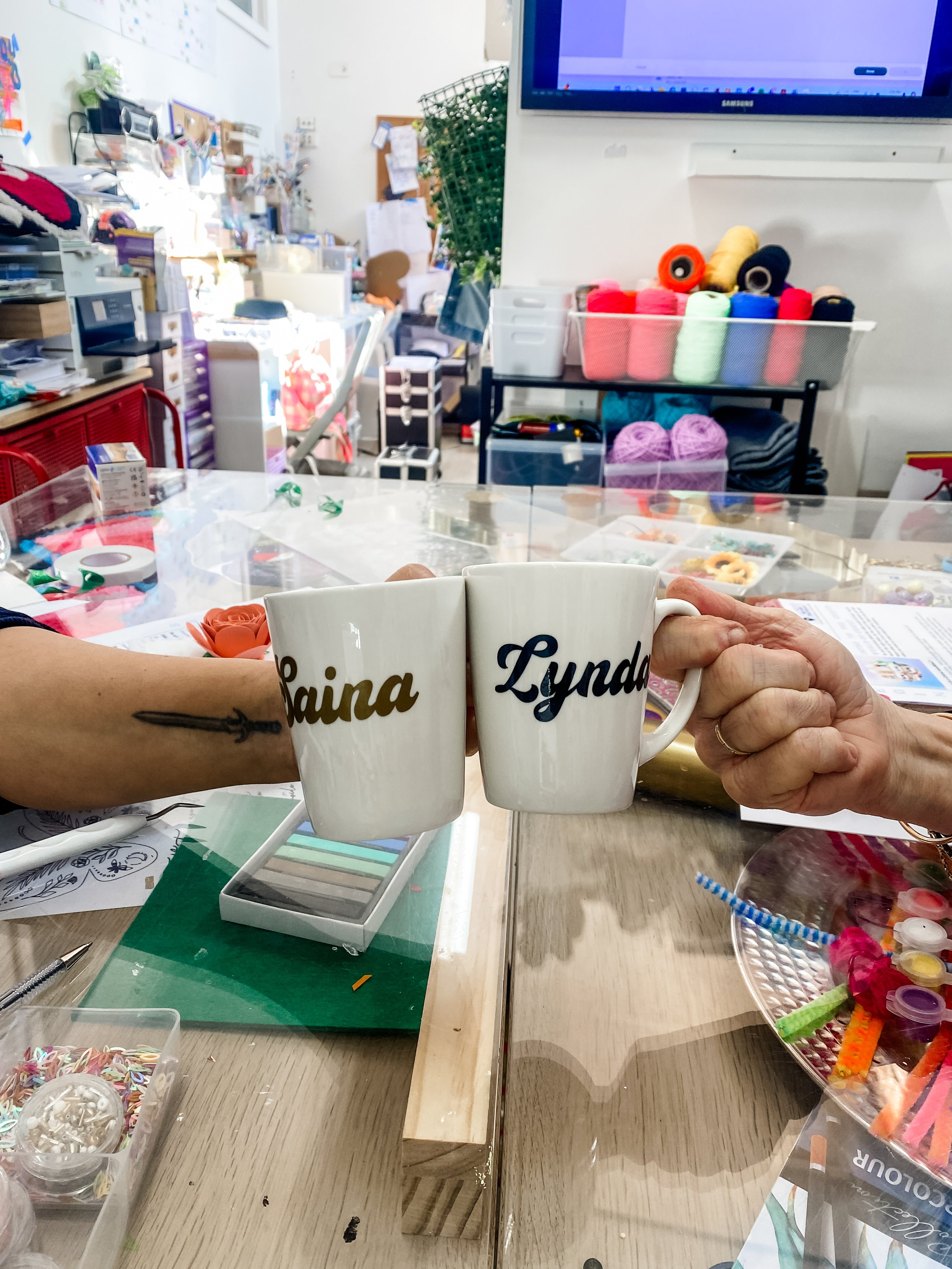 Custom Vinyl made mugs.JPG