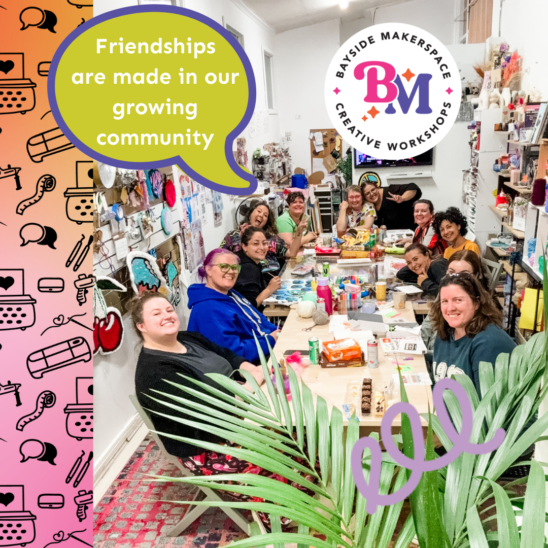 Group of cretive people smiling around the makerspace table