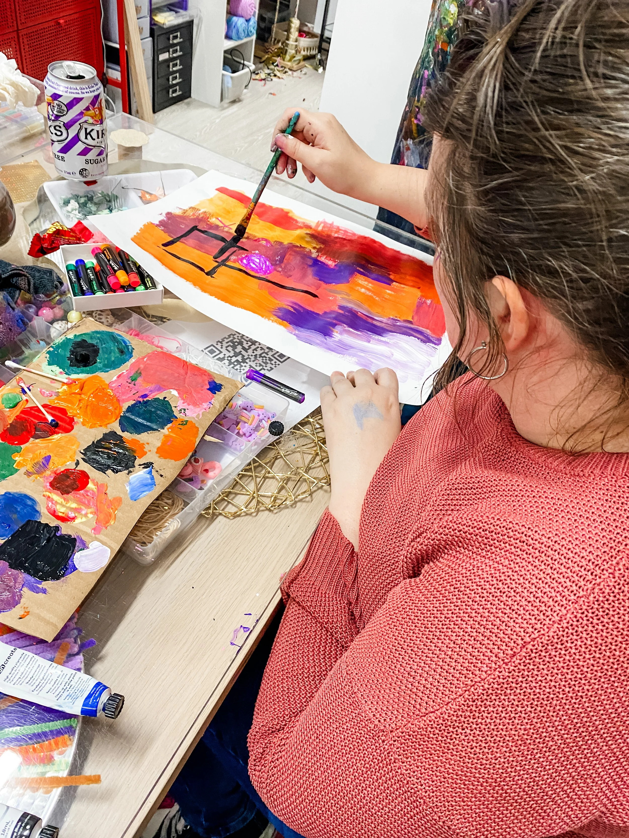 Woman working on her abstract acrylic art piece 3.JPG