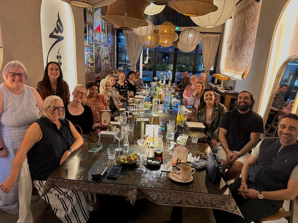 group of book club members at a restaurant