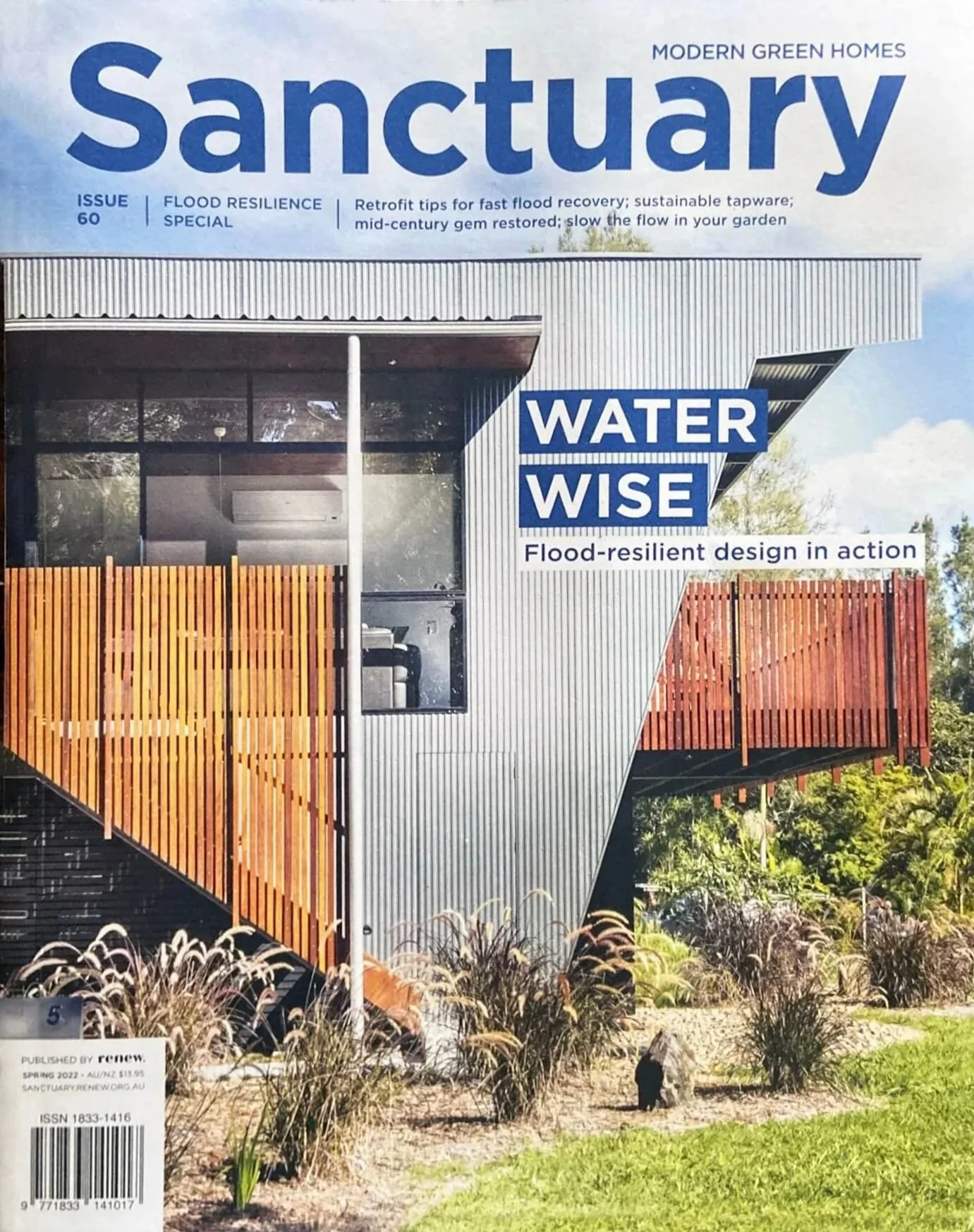 Cover of Sanctuary magazine featuring a modern building with wooden balconies, emphasizing waterwise, flood-resilient design.