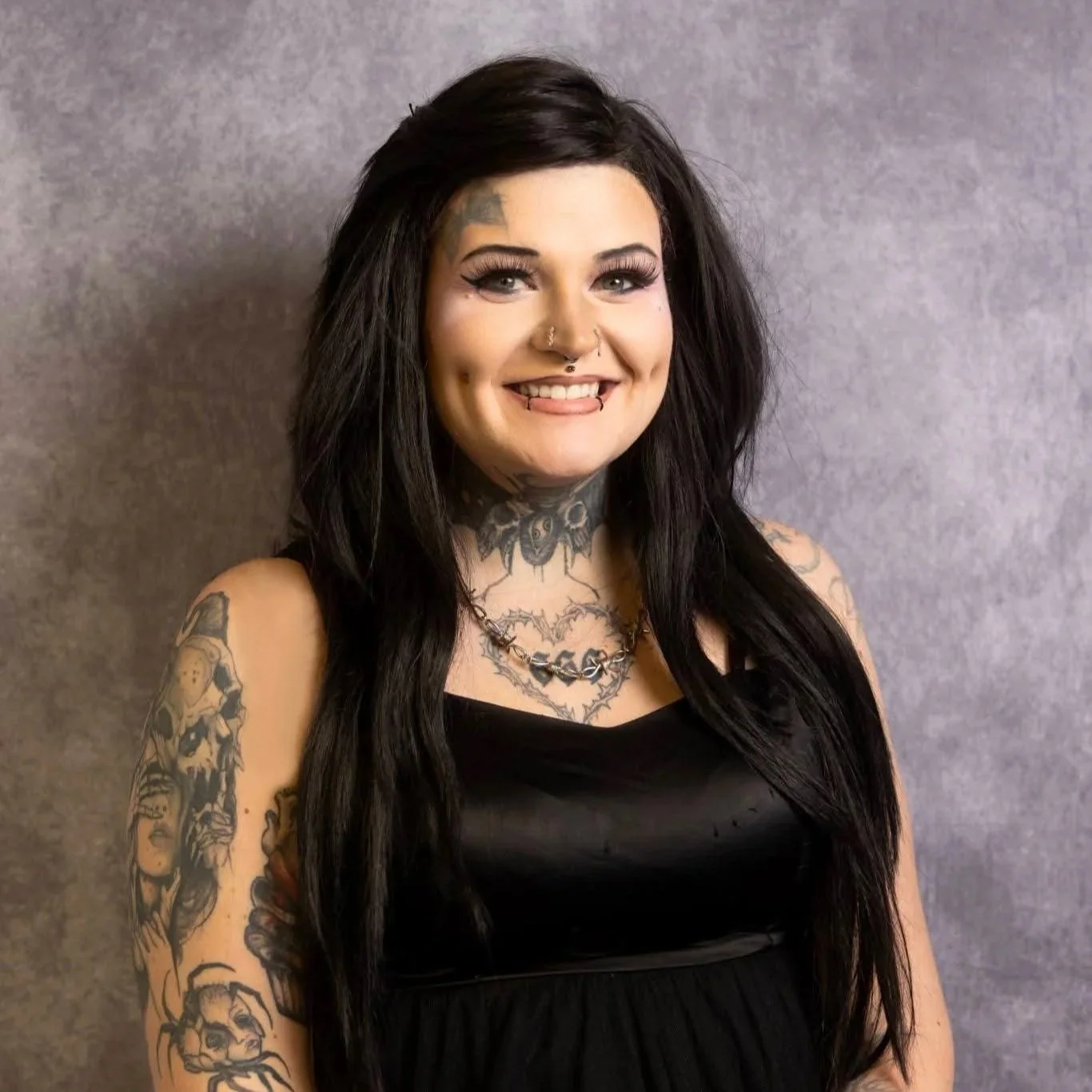 A portrait of Hexed Aesthetic (Sheena) smiling.