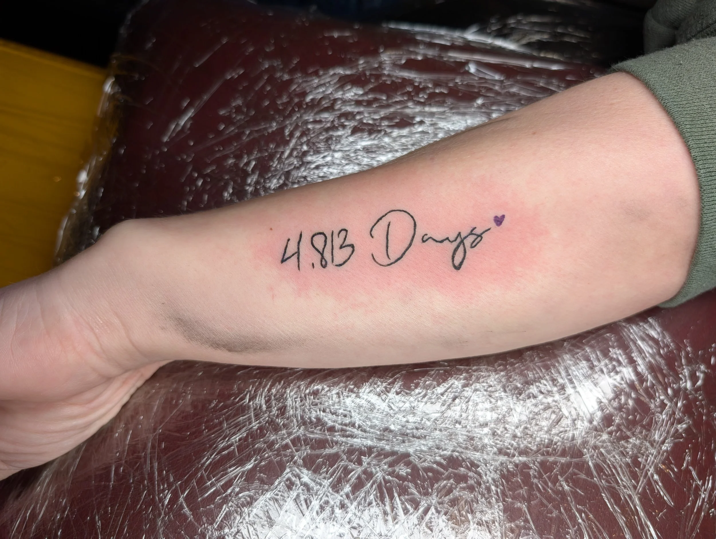 A tattoo that reads "4,813 Days."