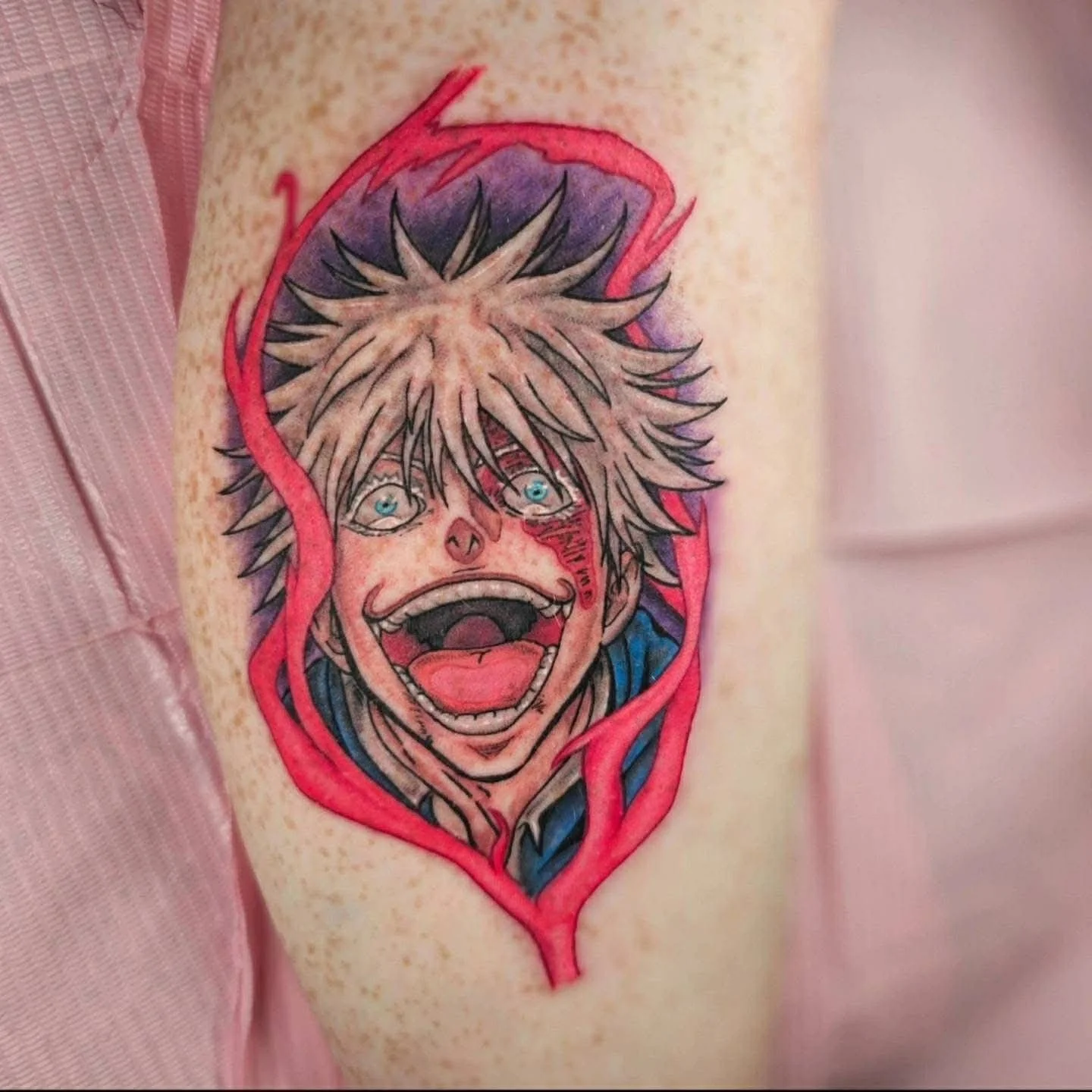 A tattoo of Gojo, a character from Jujutsu Kaisen.