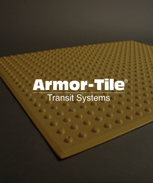 Yellow textured tile with the text "Armor-Tile Transit Systems" overlaid.