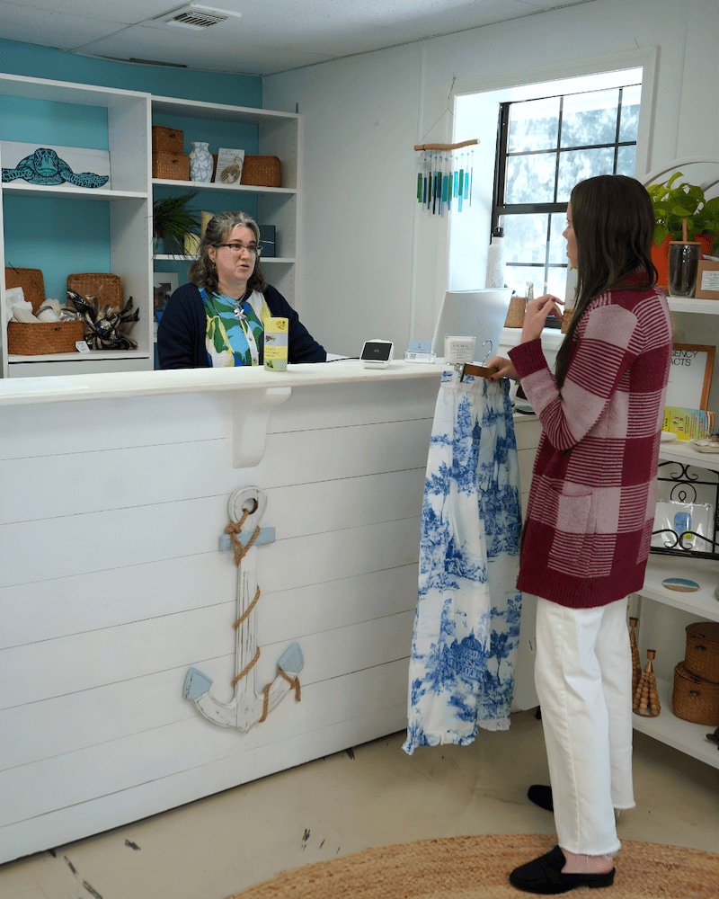 Sally Colleran CPA discussing accounting strategy with a retail client of hers from Beaufort SC.