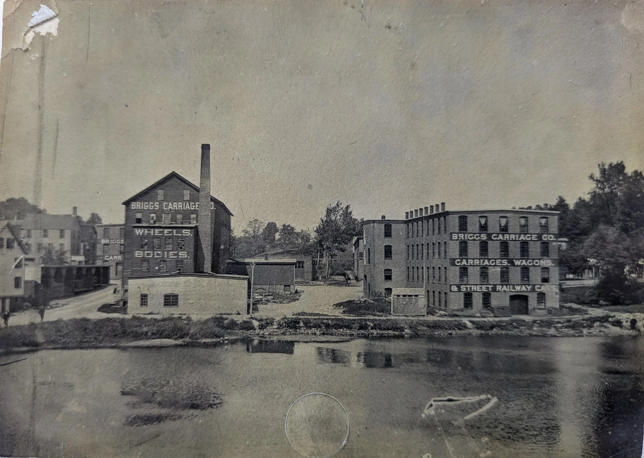 The Briggs Carriage Company, with Clark's Pond in the foreground