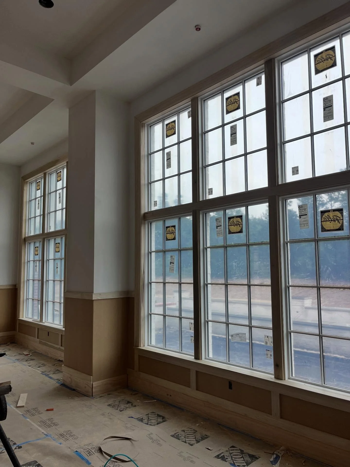 Rainy days. A great time to build a fireplace and work on all the beautiful trim details that are going to elevate your big day.
