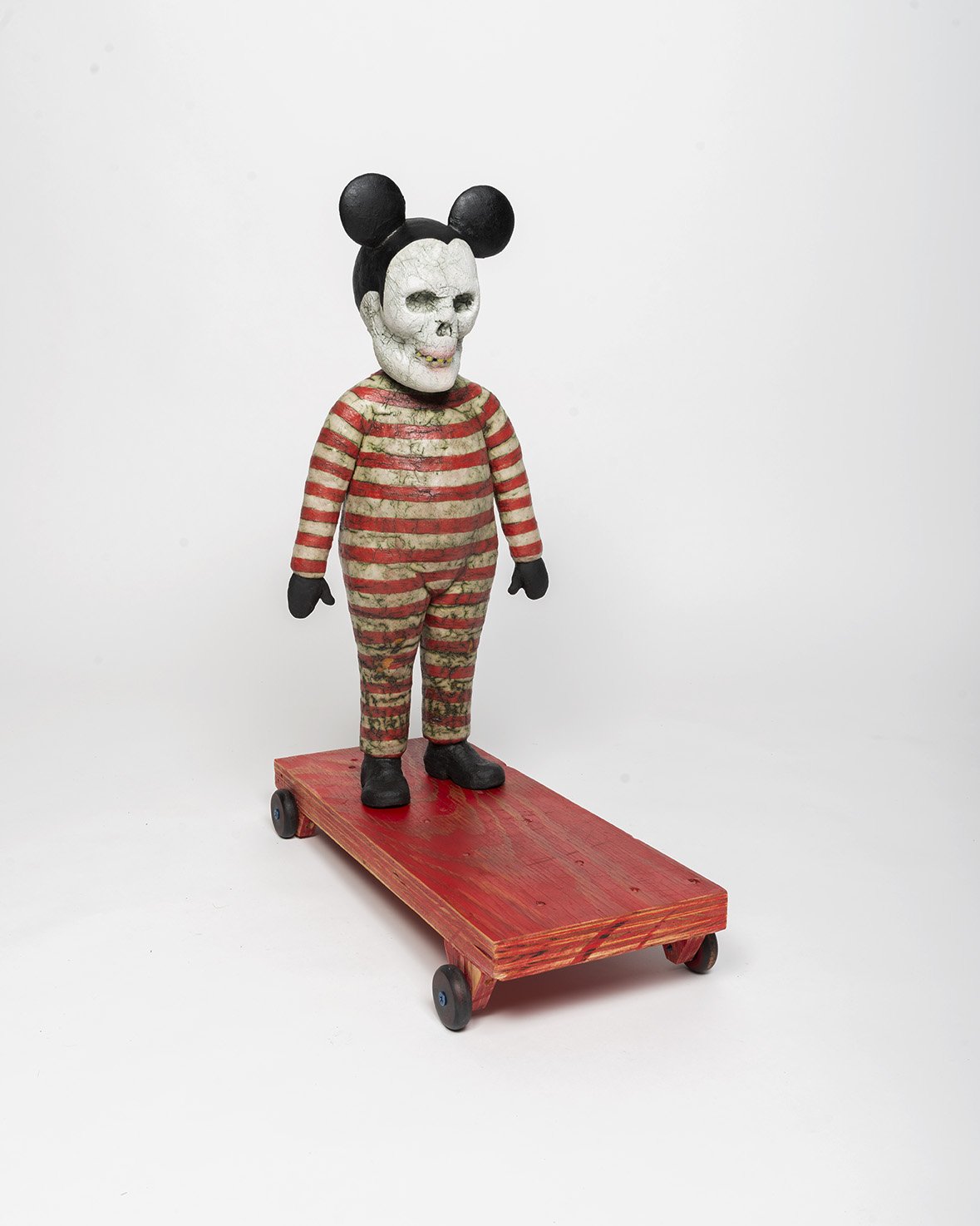 Figure Wearing Animal Skull, ceramic, mixed media 2021