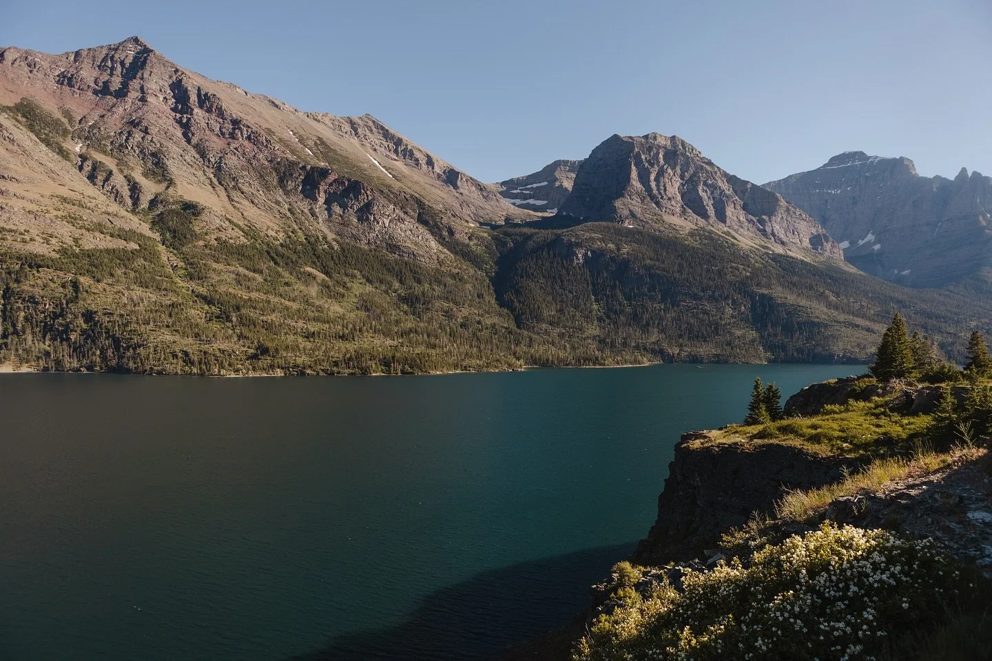 Overlooking Saint Mary Lake in East Glacier 😍 The water was so clear and blue, pure beauty. 
This is one of my favorite photos I’ve taken this year! 
#canonusa #canonphoto #adventurephoto #travelphotographer #adventuremore #glaciernationalpa