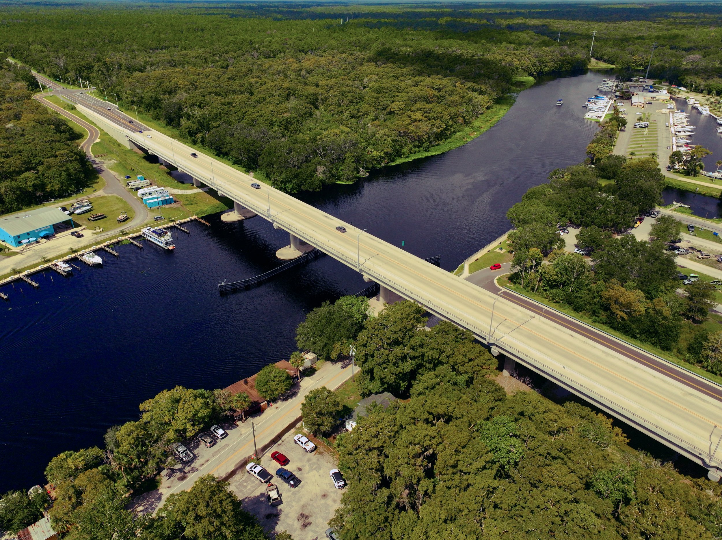 An aerial view of the SR-44 bridge crossing over the St. John's River.  DeLand, Florida. DJI Mavic 3 Pro. Professional drone photography.