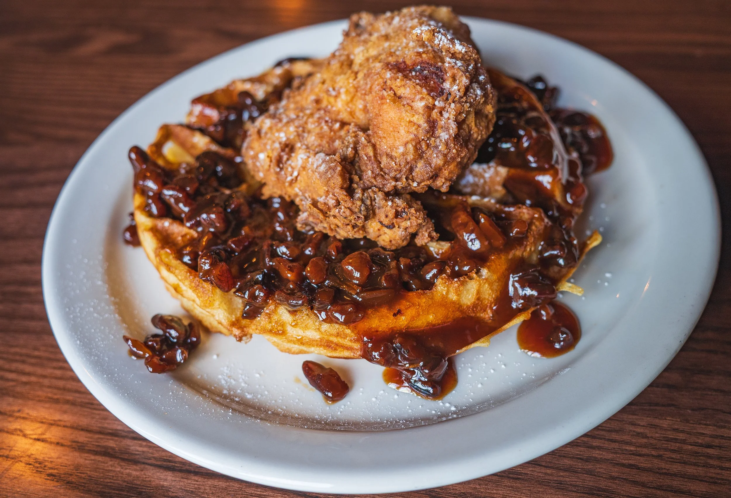 Chicken and waffles topped with syrup at Uncle Bill’s Pancake House in South St. Louis