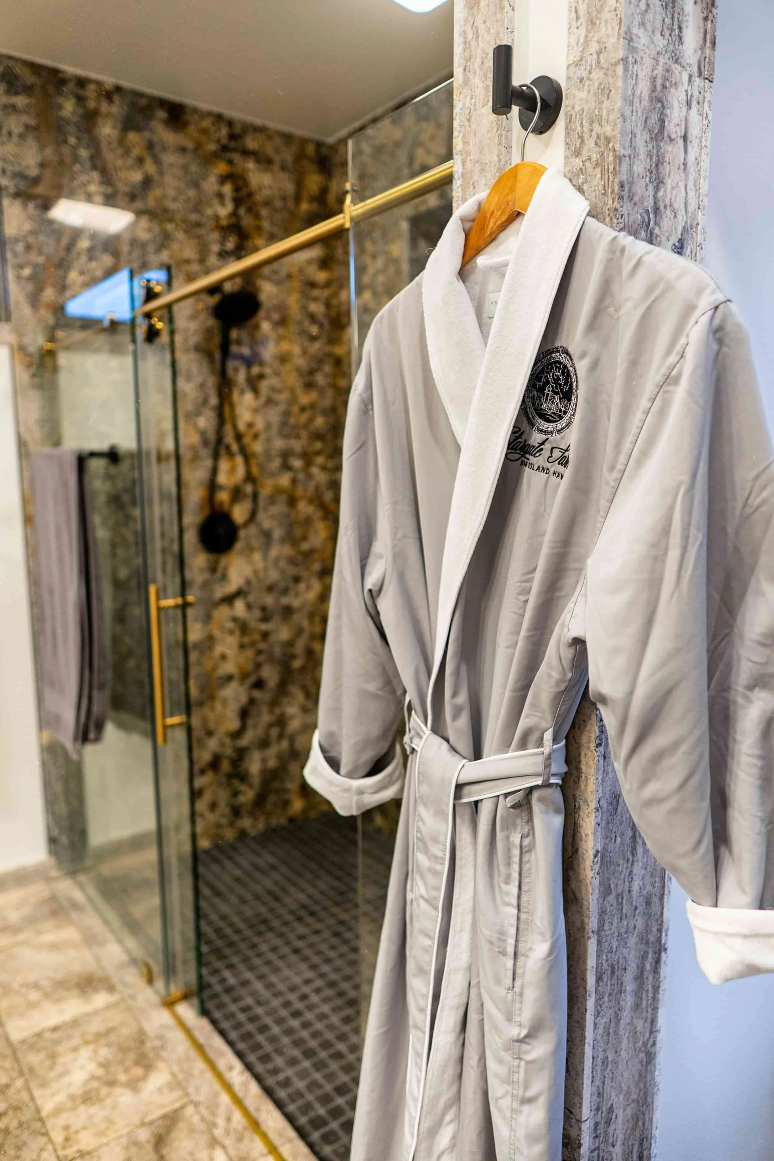 Stargate Farm luxury spa robe hanging in granite bathroom at Hawaii farm vacation rental North Kohala.jpg
