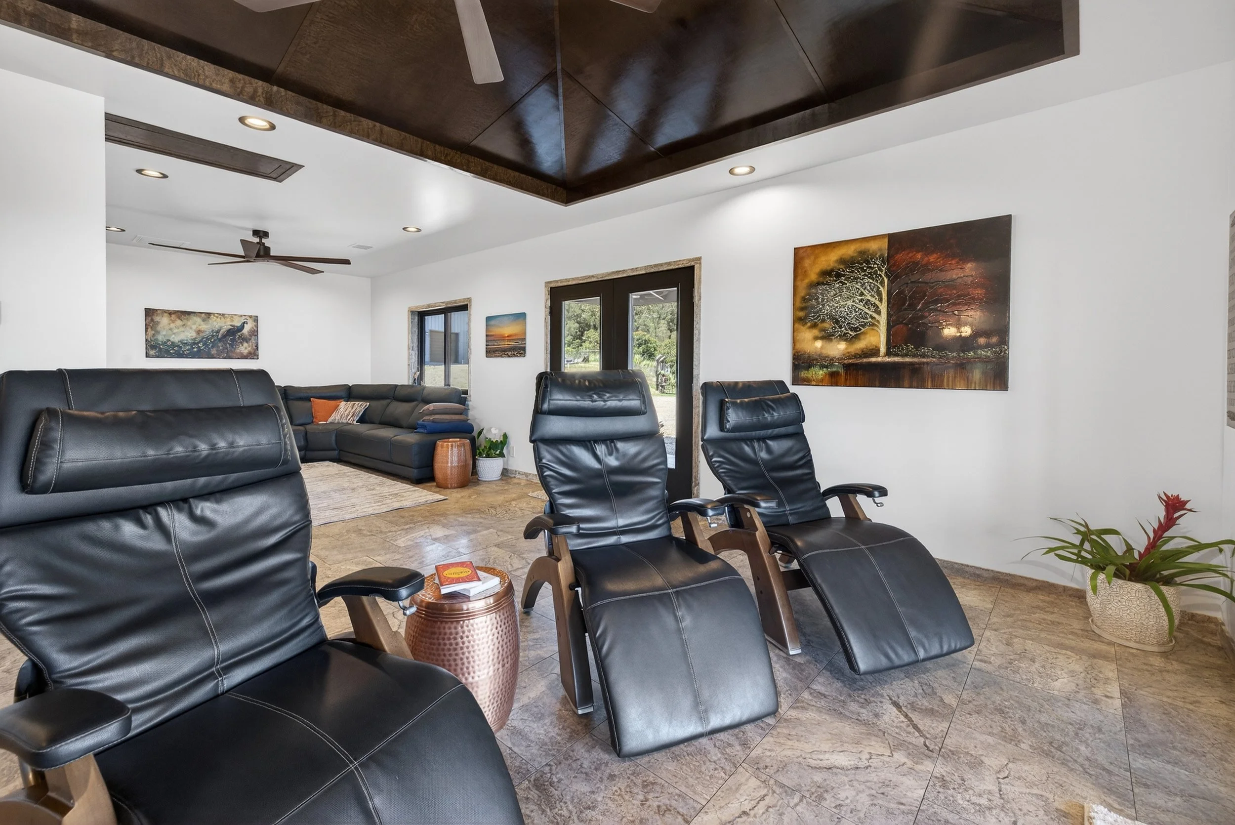 Indoor recliners overlooking the ocean at Stargate Farm luxury rental North Kohala Hawaii