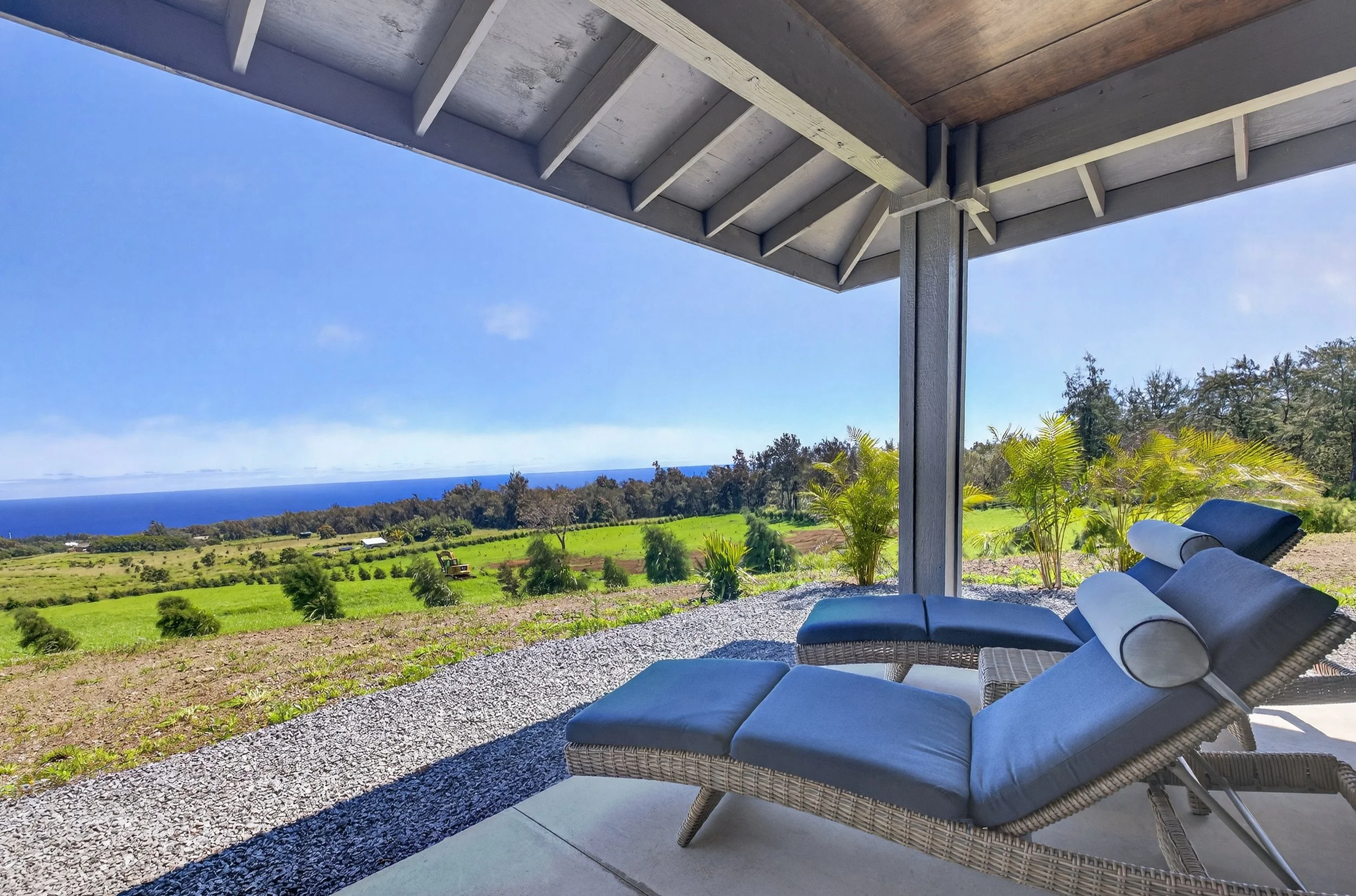 Back patio with panoramic ocean views at Stargate Farm luxury vacation rental North Kohala Hawaii