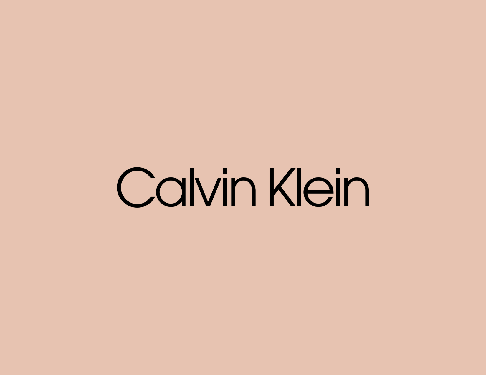 Calvin Klein logo on a beige background.