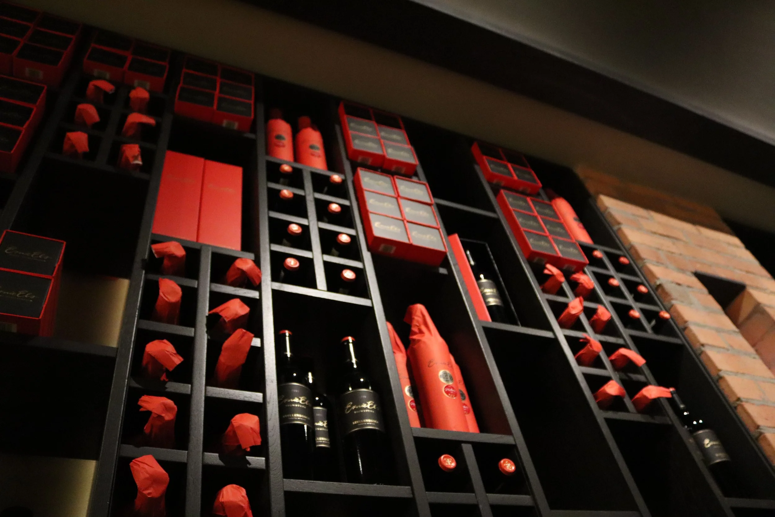 A collection of primarily red colored wines