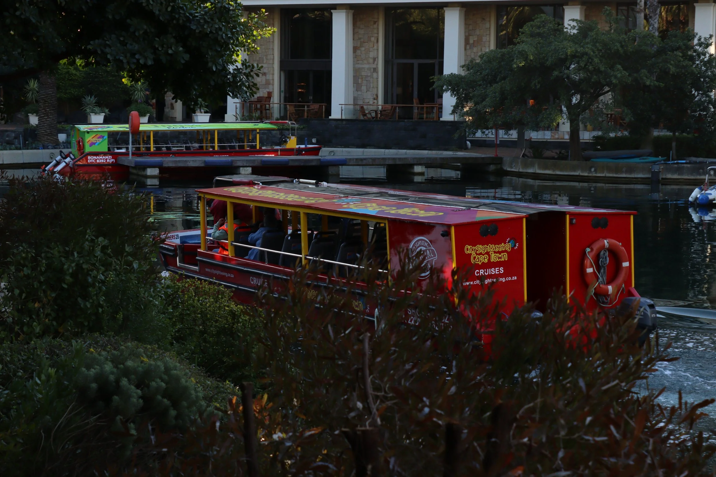 A tour boat passes by near the V&A Waterfront