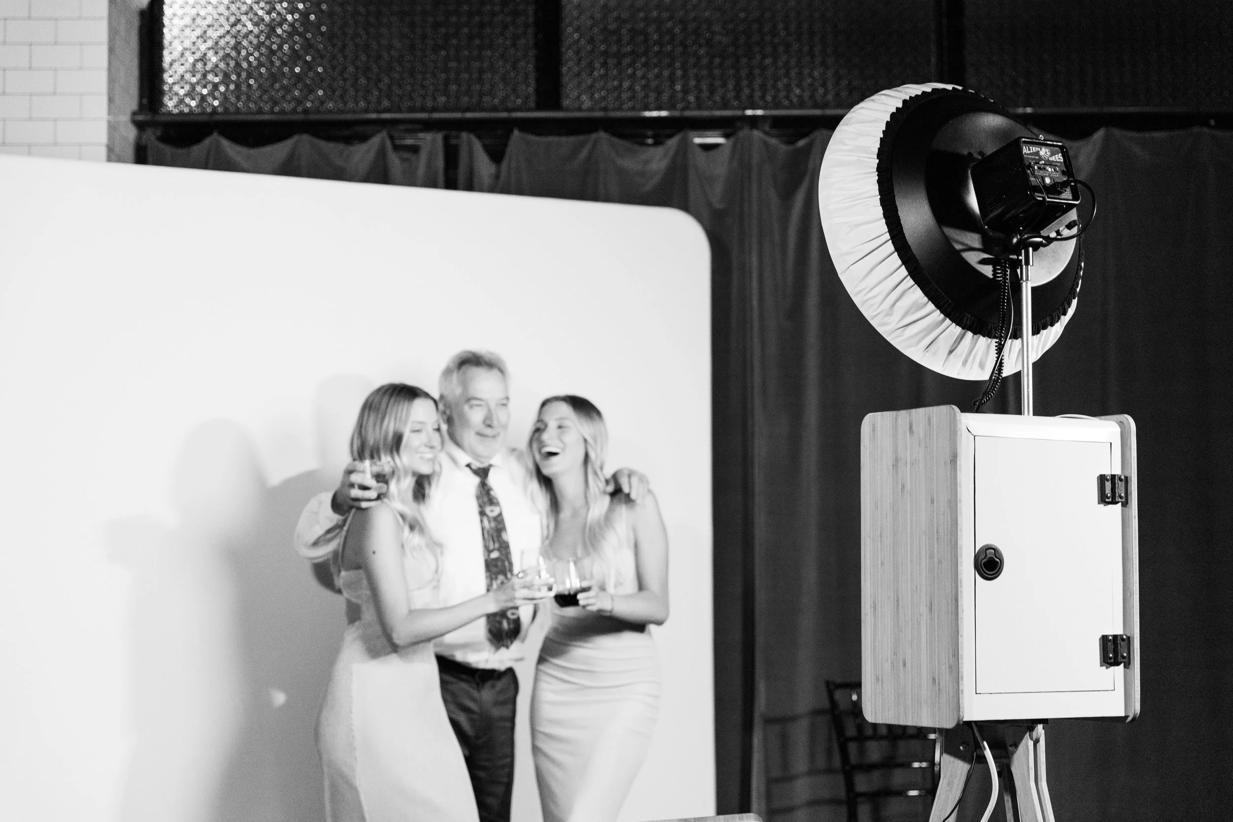 the glam photo booth with set up and custom backdrop.jpeg