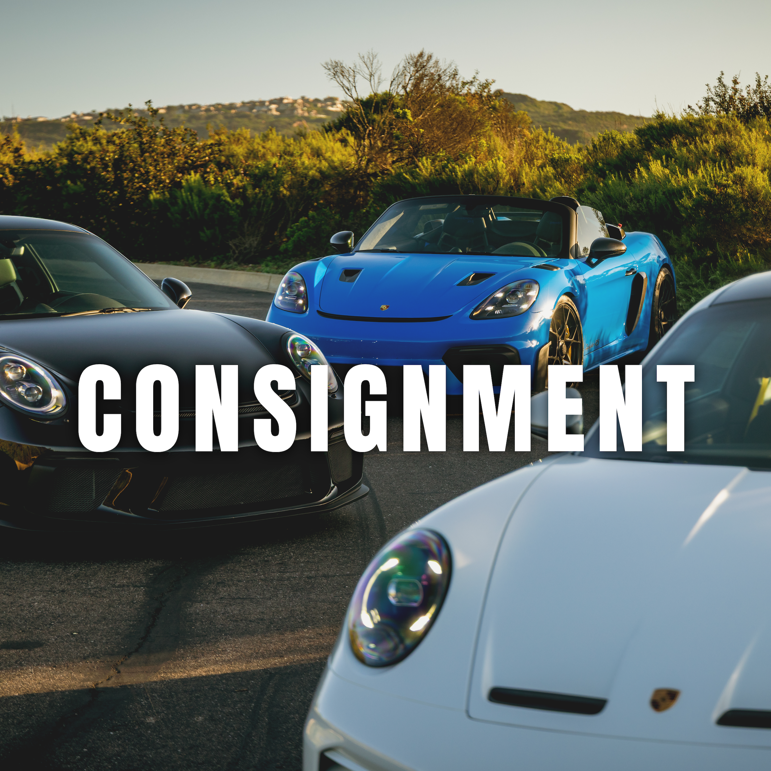 Three luxury sports cars parked outdoors with one blue and two black and white; the blue one is a convertible. The word "CONSIGNMENT" is overlaid in large white letters.