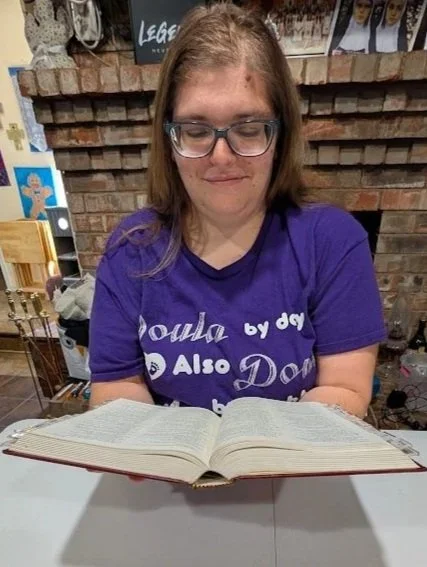 Doula Melanie Powell prayerfully praying for her clients.